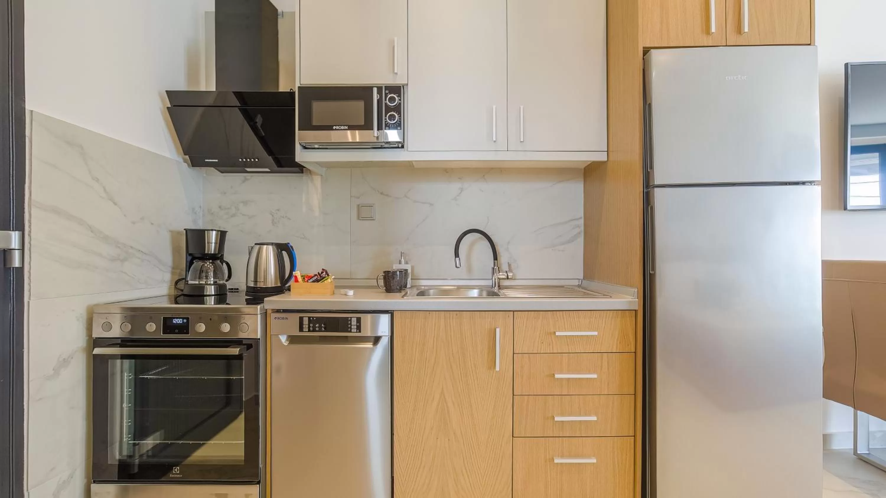 Kitchen or kitchenette in Kima Premium Apartments