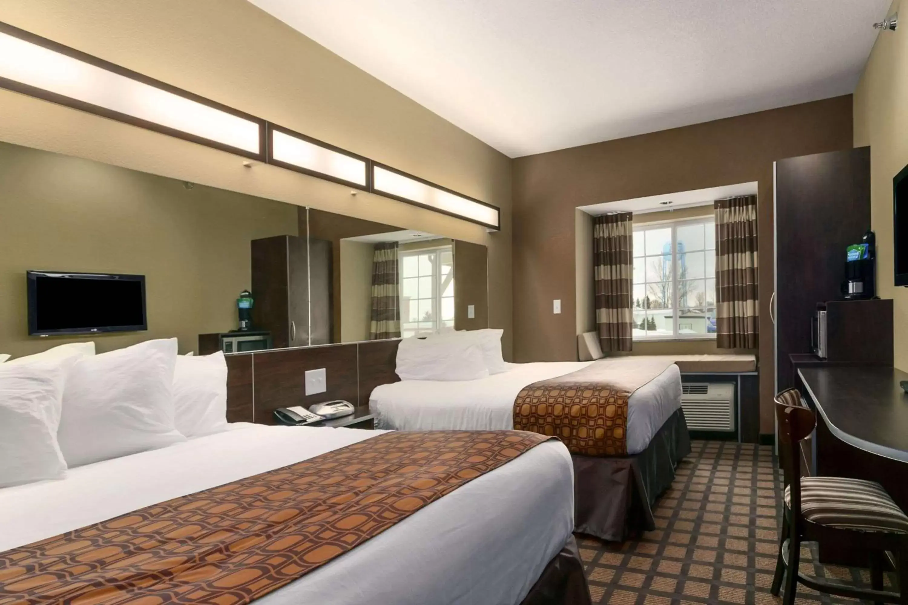 Photo of the whole room, Bed in Microtel Inn & Suites by Wyndham Minot