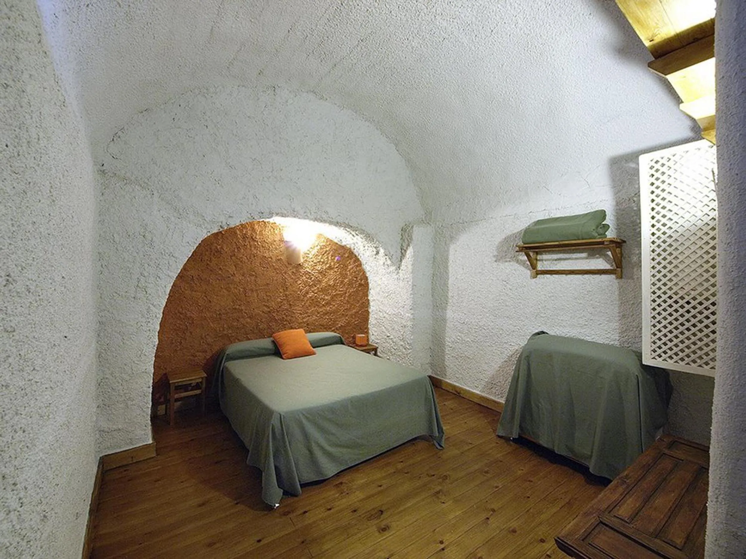 Bedroom, Bed in Casas Cueva y Cortijo La Tala en Guadix