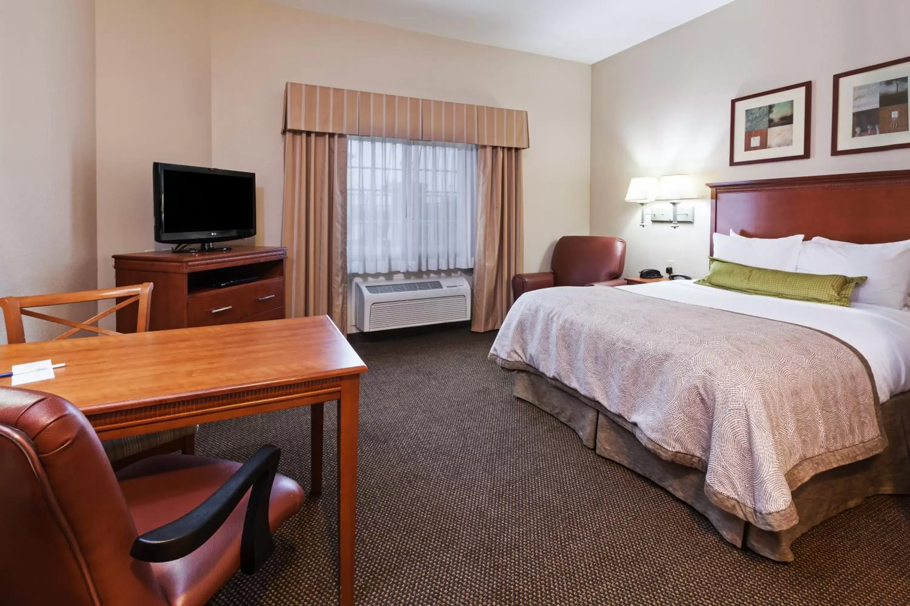 Photo of the whole room, TV/Entertainment Center in Candlewood Suites Deer Park, an IHG Hotel