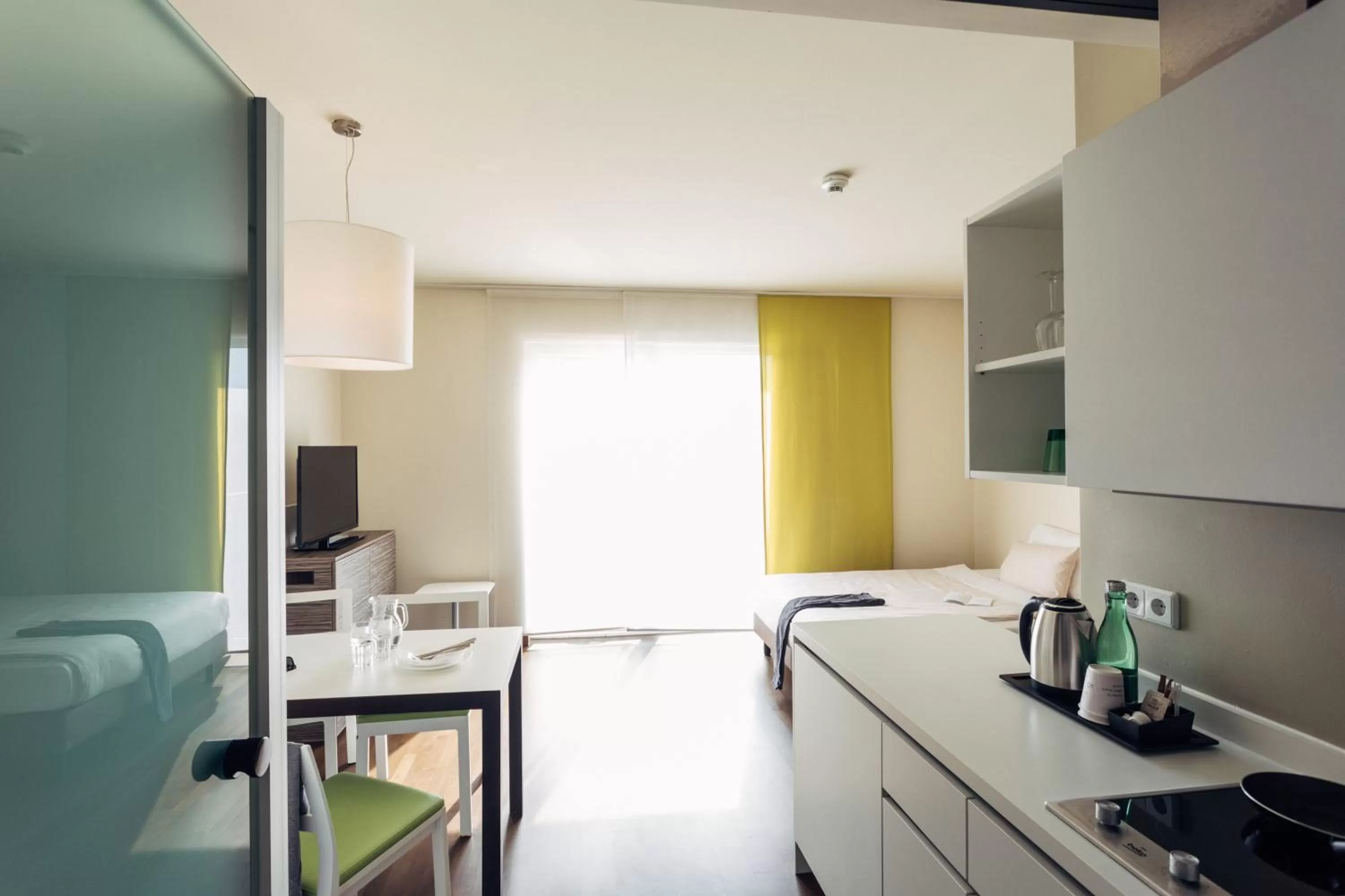 Kitchen or kitchenette in harry's home Linz-Urfahr hotel & apartments