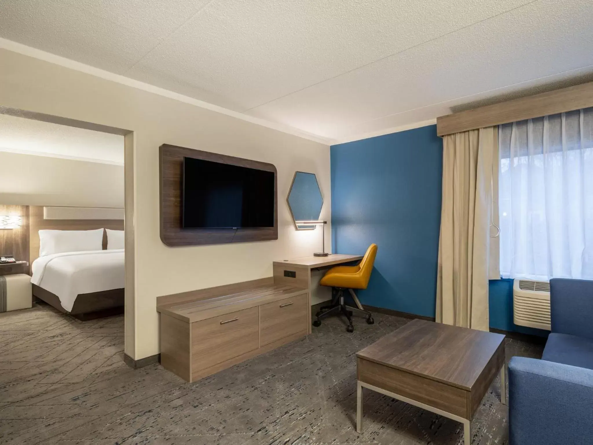 Photo of the whole room, TV/Entertainment Center in Holiday Inn Express & Suites Greensboro - I-40 atWendover, an IHG Hotel