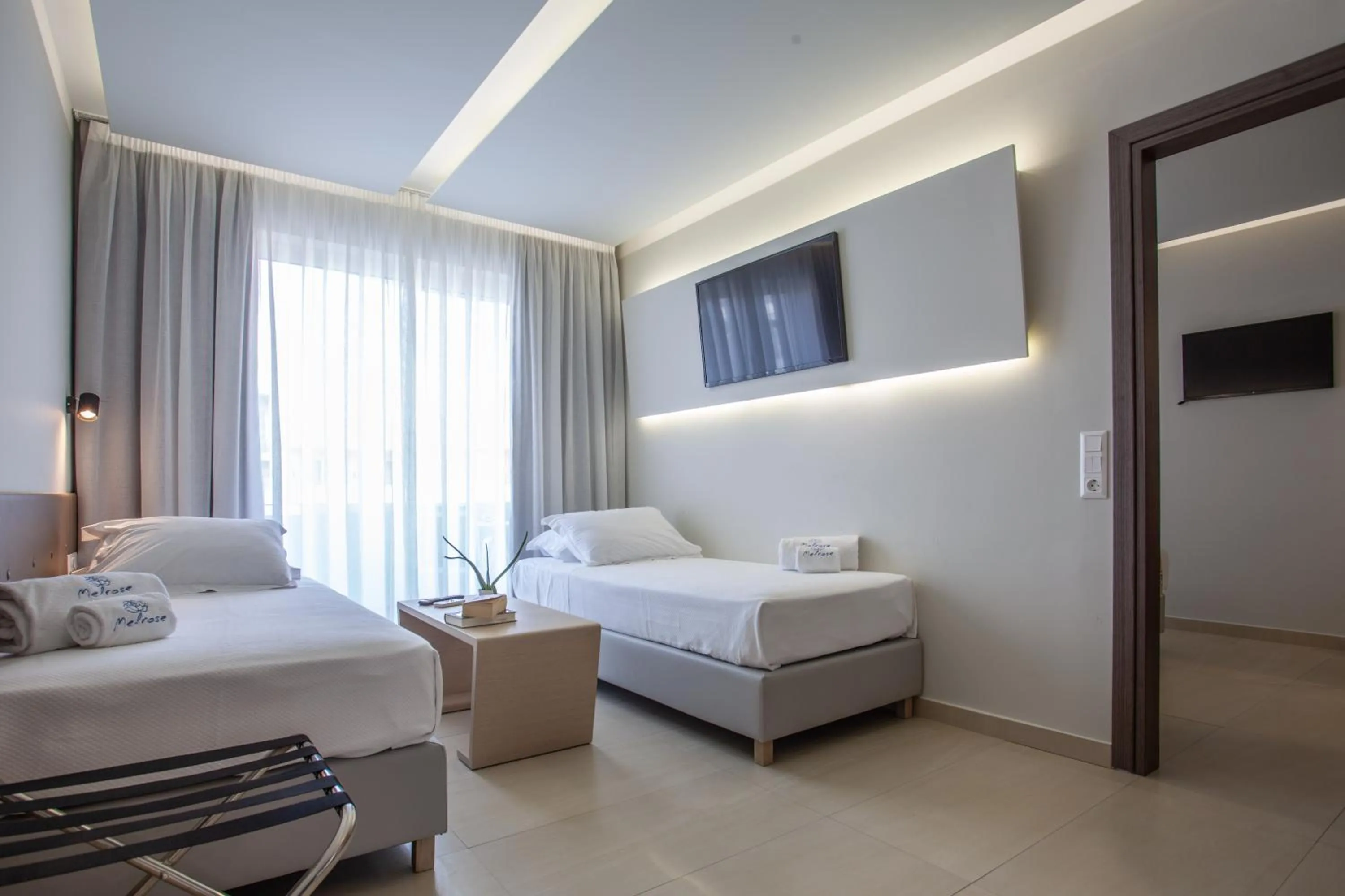 Living room, Bed in Melrose Rethymno by Mage Hotels