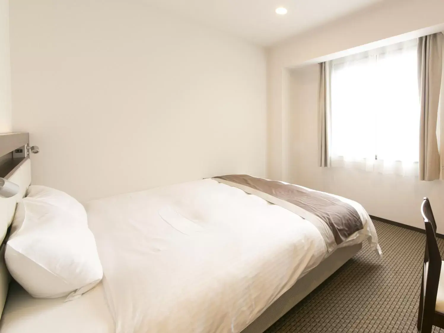 Bed in Urban Hotel Minami Kusatsu Bed in Urban Hotel Minami Kusatsu