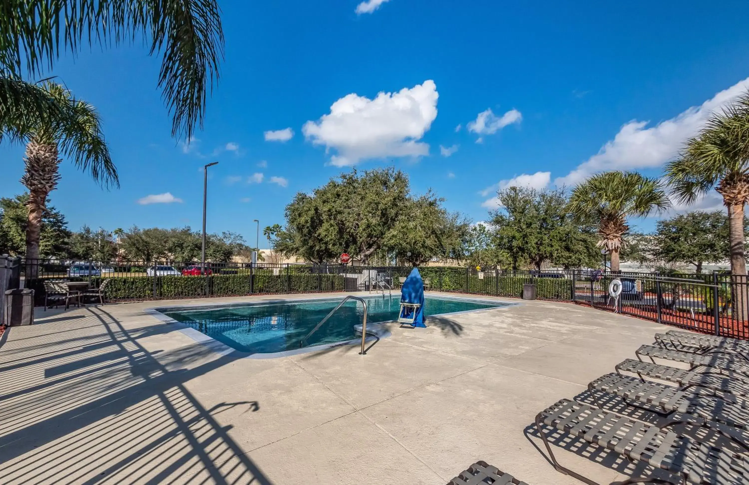 Swimming pool, Patio/Outdoor Area in HomeTowne Studios by Red Roof Orlando South