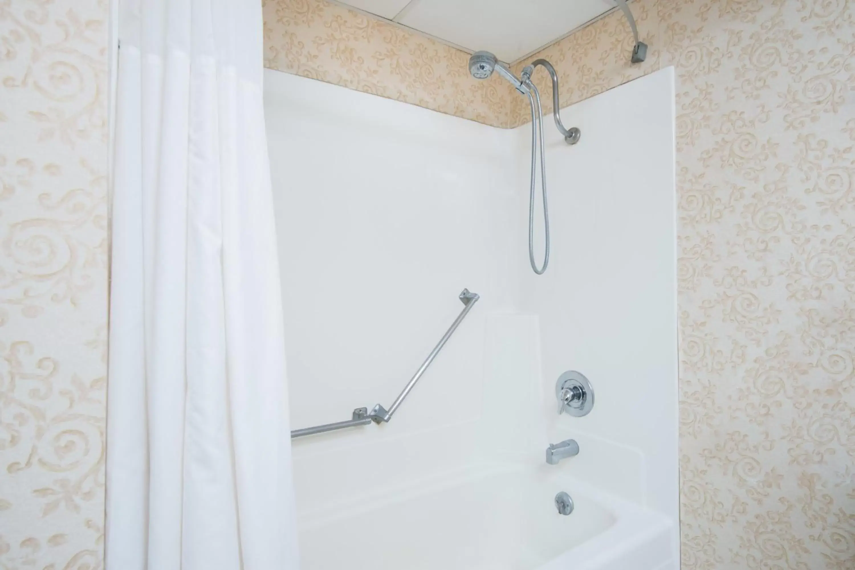 Bathroom in Ramada Plaza by Wyndham Gillette Conference Center