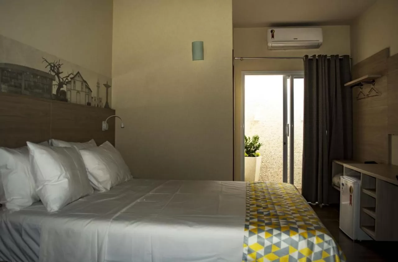 Photo of the whole room, Bed in Pousada Araxá