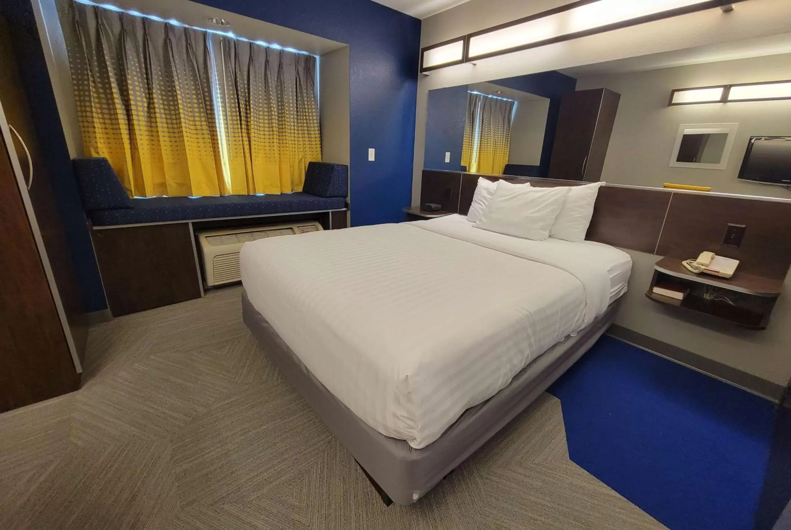 Bed in Microtel Inn & Suites by Wyndham Bluffs