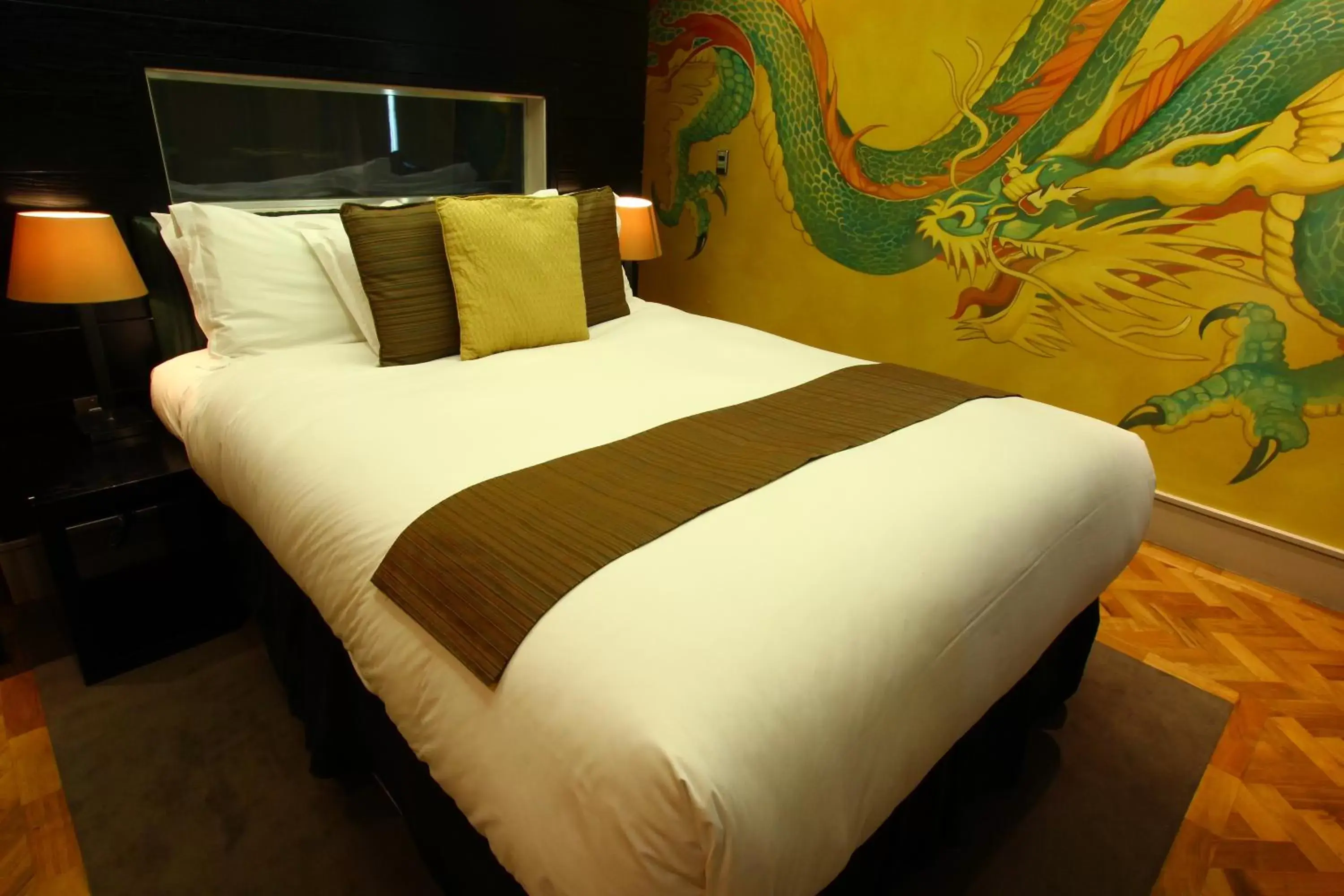Bed in Le Monde Hotel