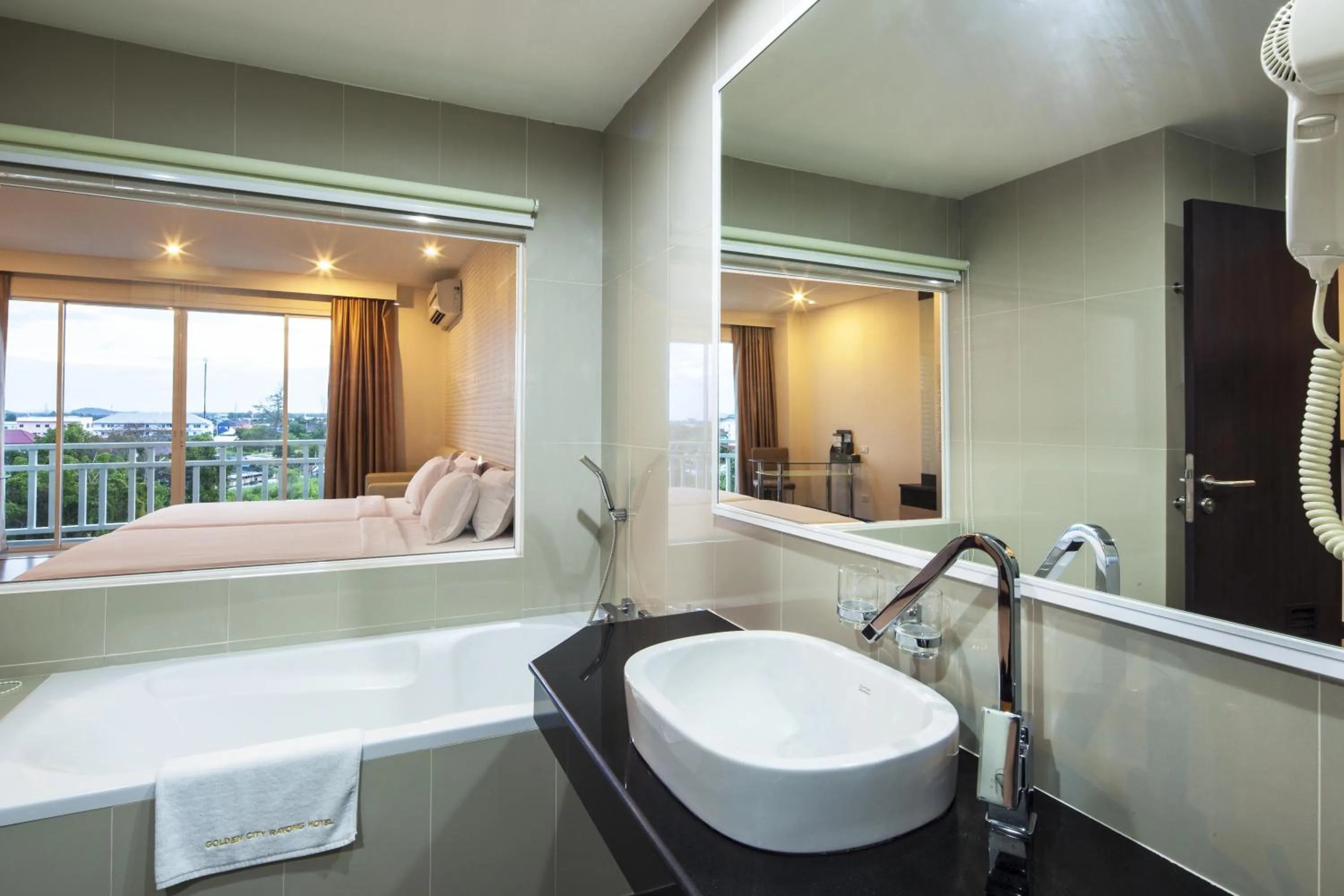 Bathroom, Bed in Golden City Rayong Hotel