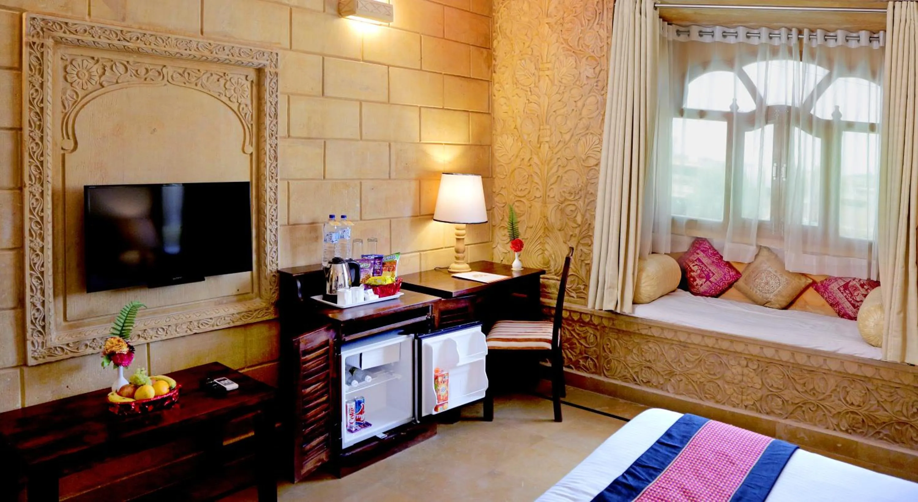 Seating area, Bed in Hotel Golden Haveli