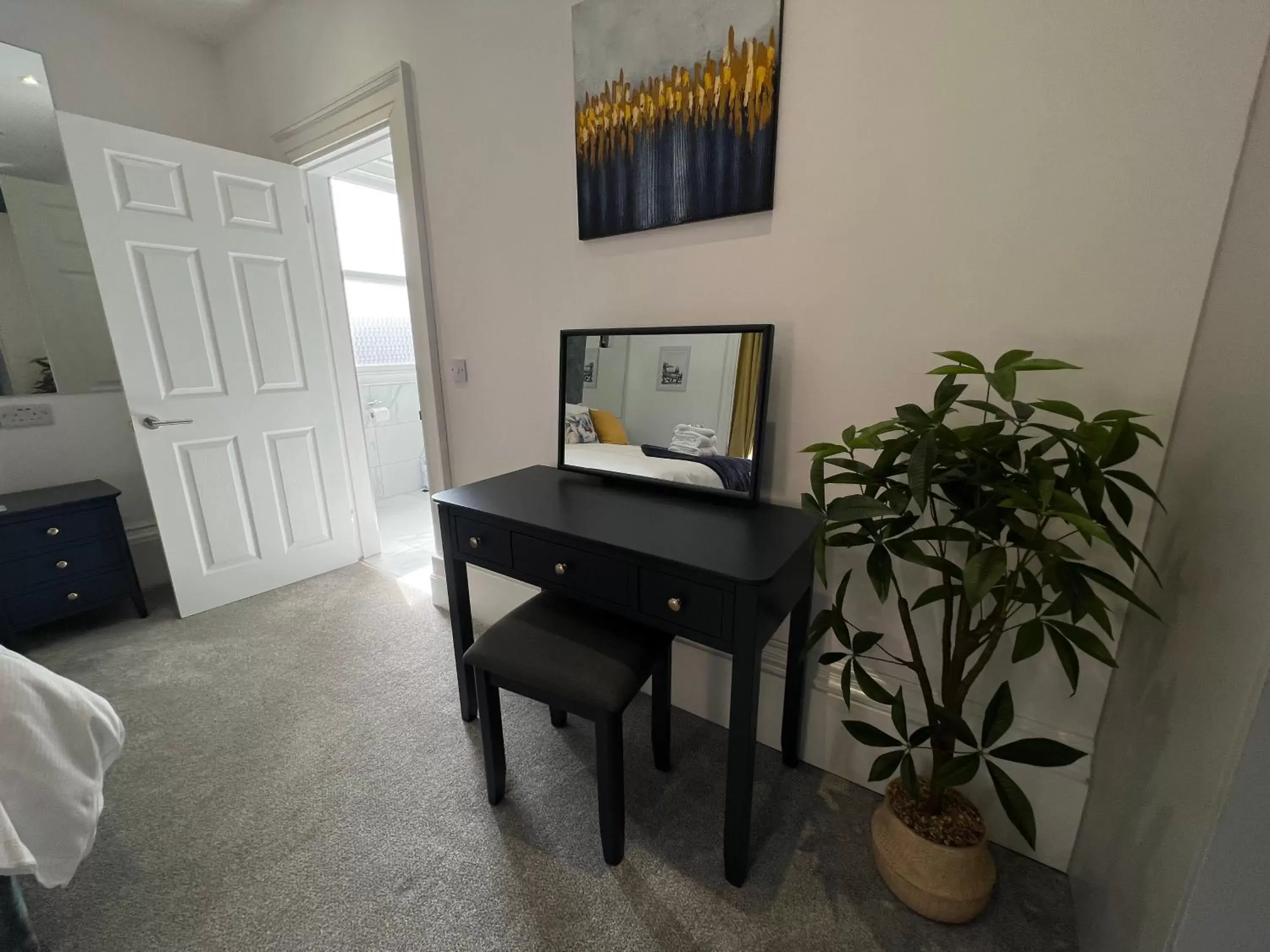 Bedroom, TV/Entertainment Center in Winckley Square Residences