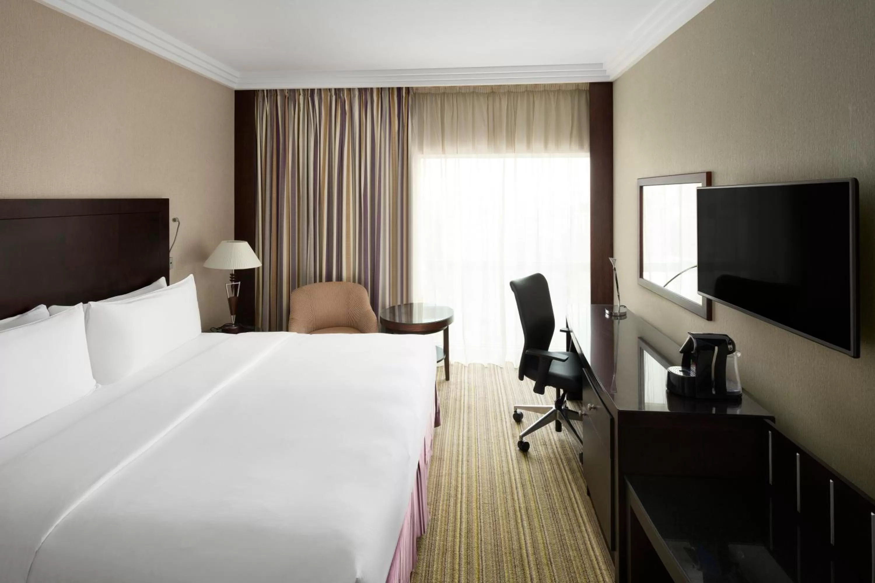 Photo of the whole room, Bed in Crowne Plaza Jeddah by IHG