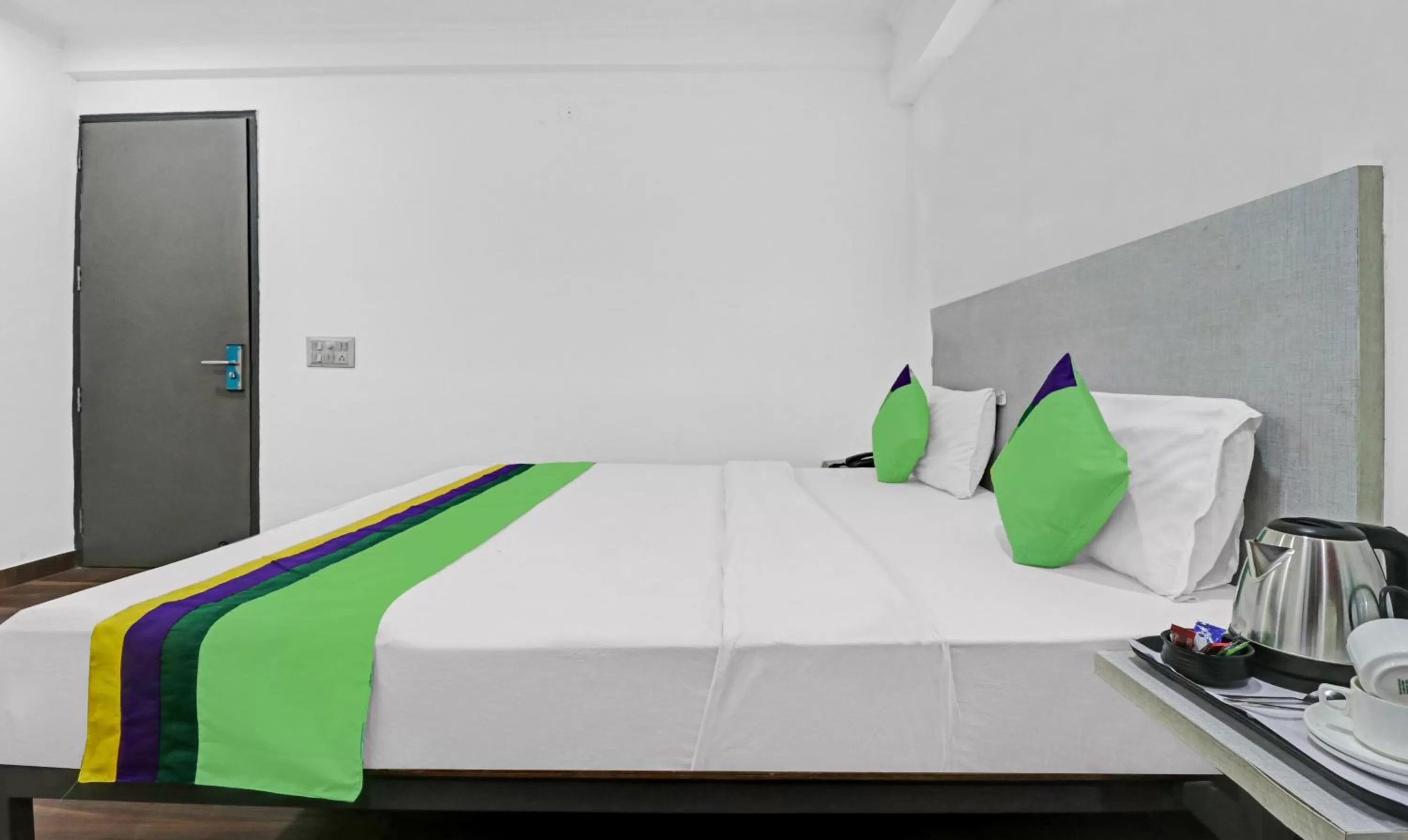 Bedroom, Bed in Treebo Grand Town House