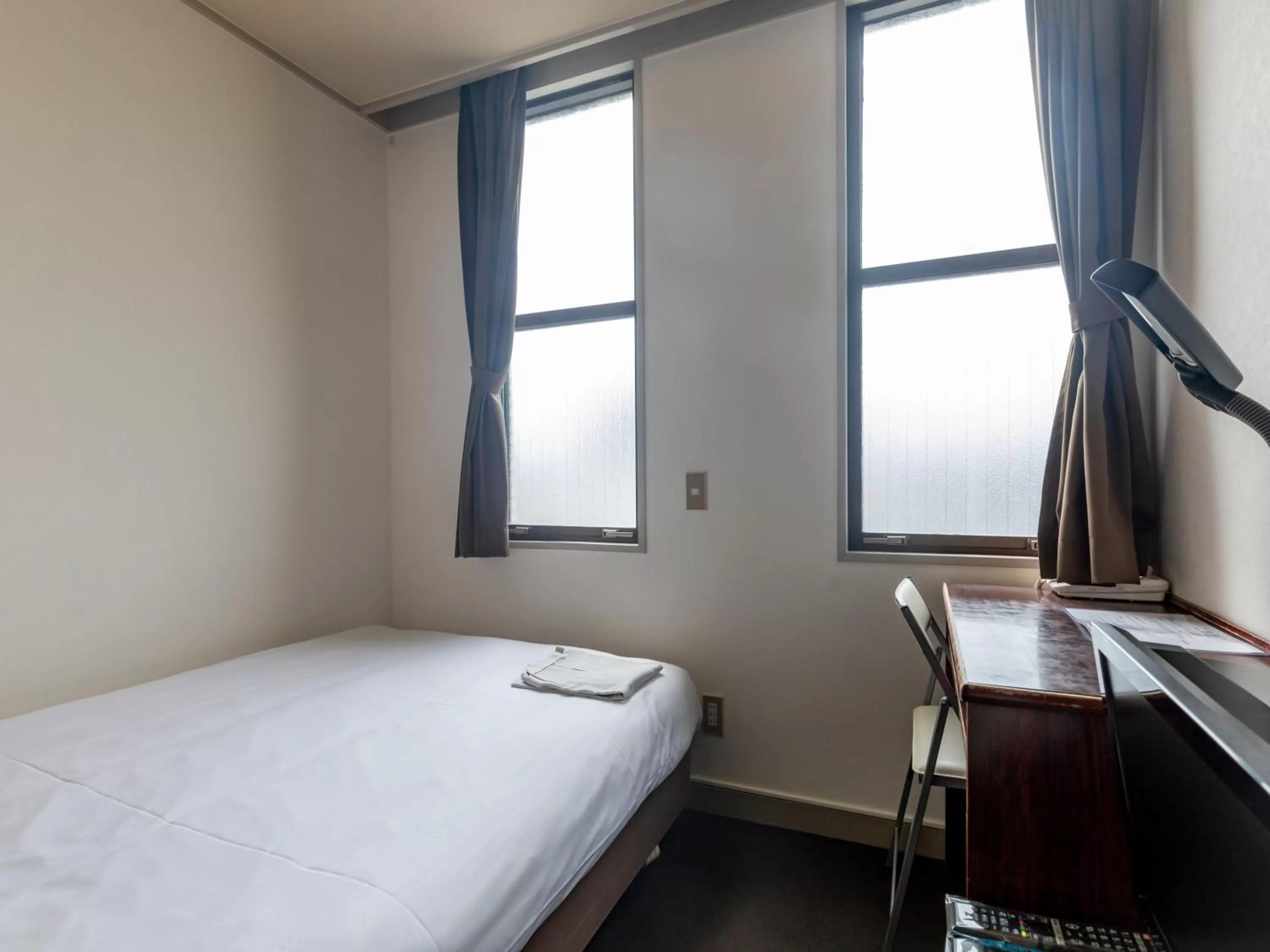 Photo of the whole room, Bed in Tabist Business Hotel Suehiro Matsuyama