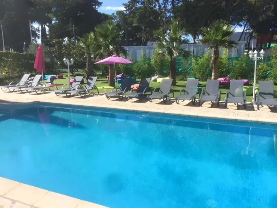 Day, Swimming Pool in Hotel & Restaurant Le Mejean - Parc des Expositions