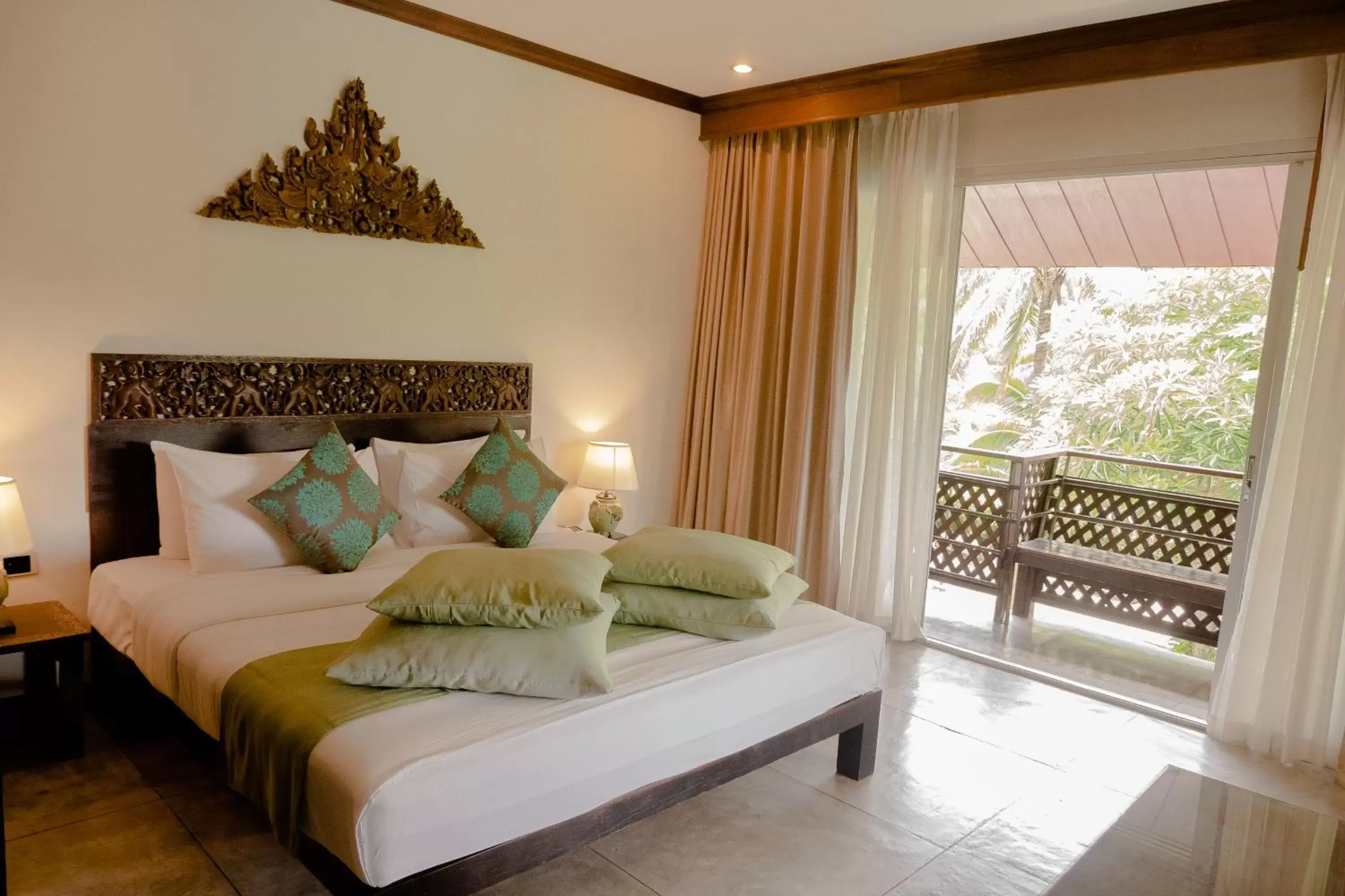 Bed in Royal River Kwai Resort and Spa Bed in Royal River Kwai Resort and Spa