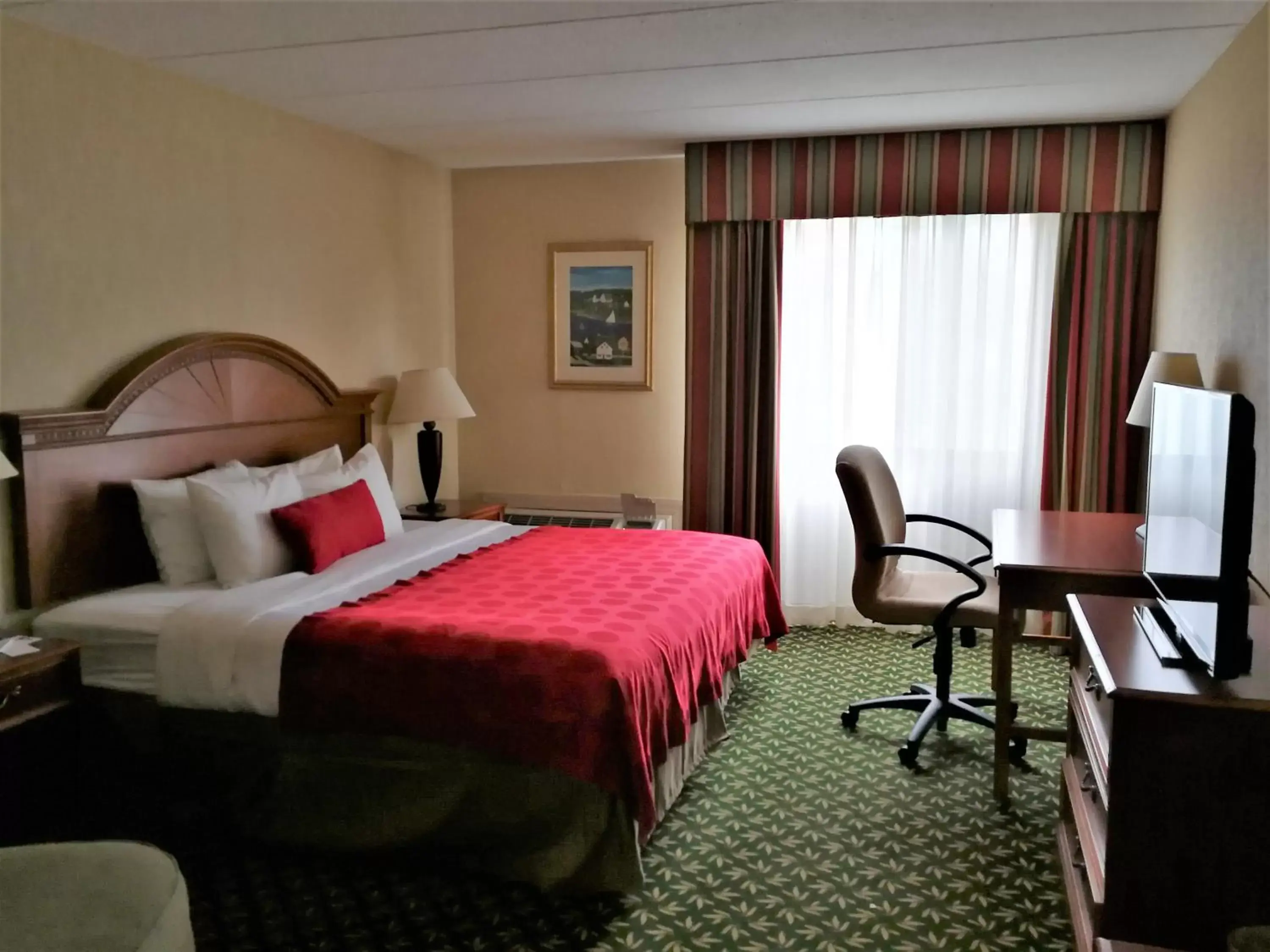 Bed in Mystic River Hotel & Suites
