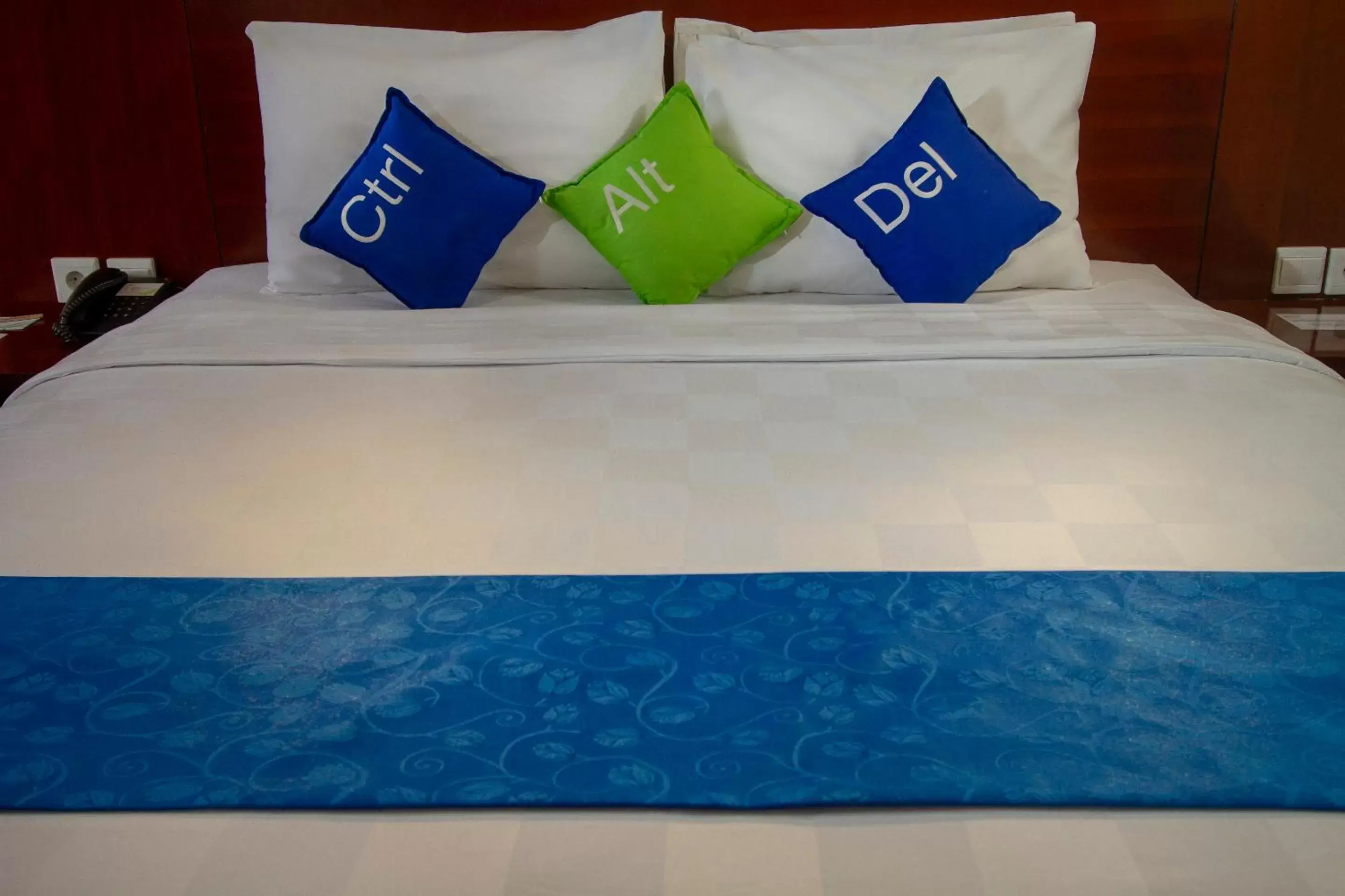 Bed in PrimeBiz Hotel Kuta