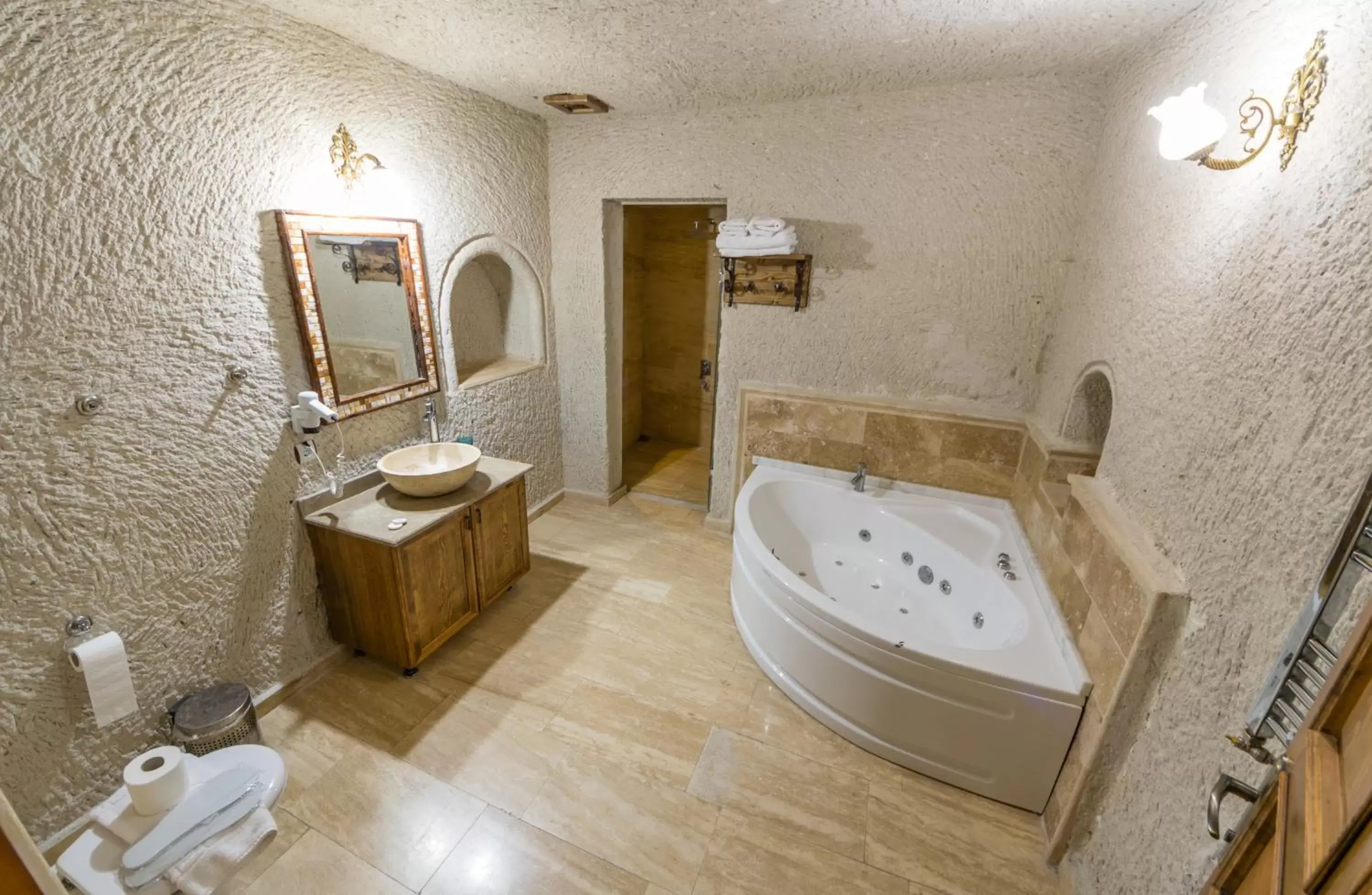Bed, Bathroom in Elite Cave Suites