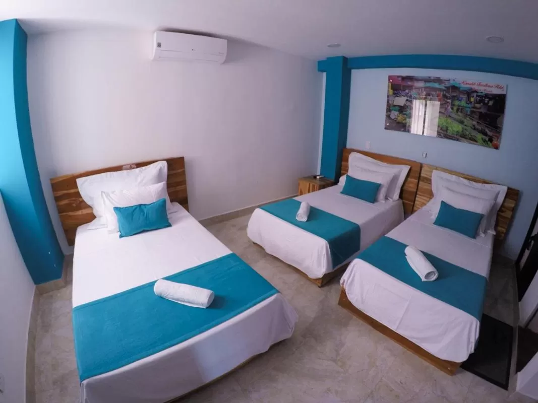 Bed in Kamaleb Farallones Hotel