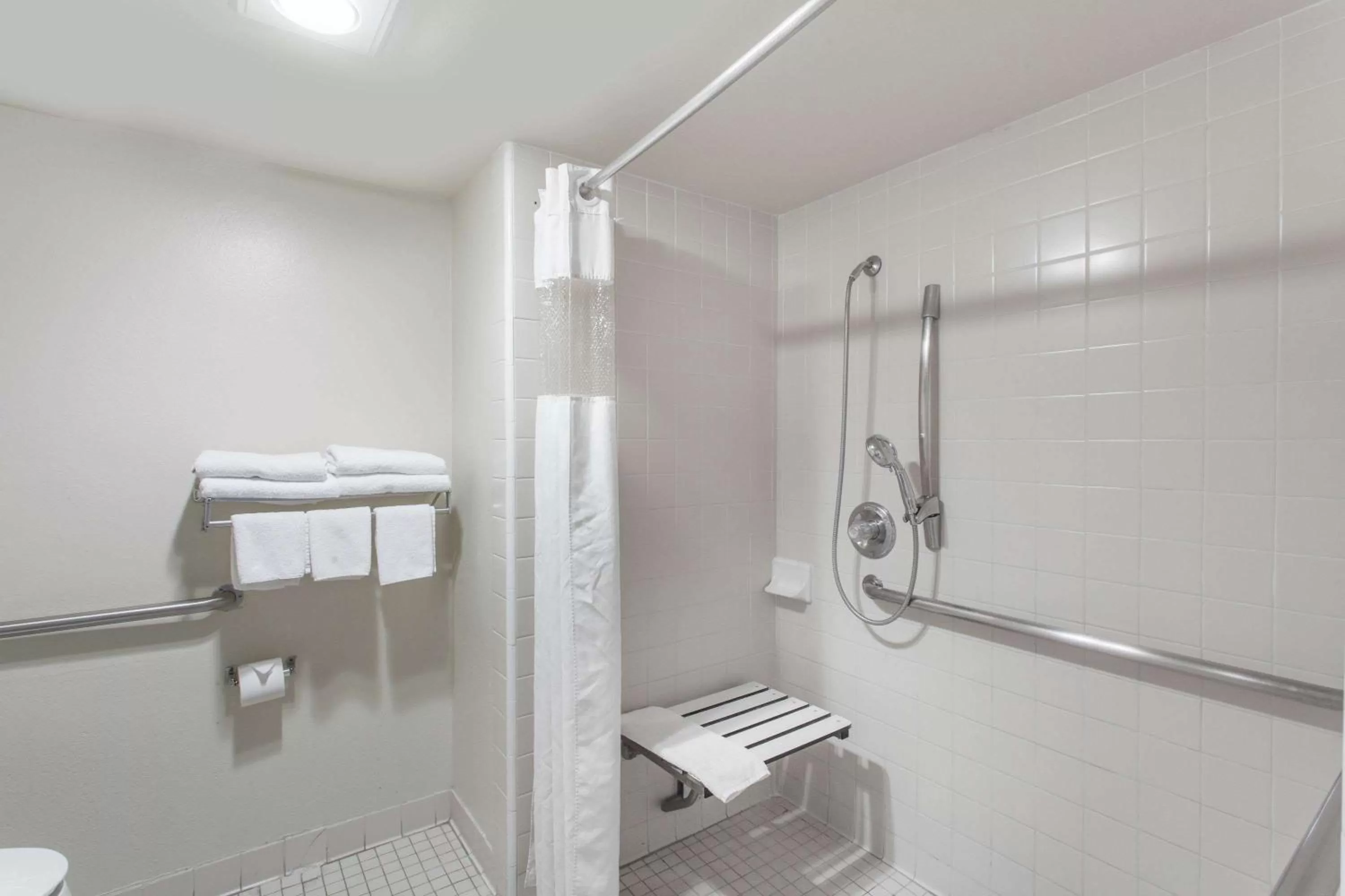 Bathroom in Days Inn by Wyndham Anaheim Near the Park