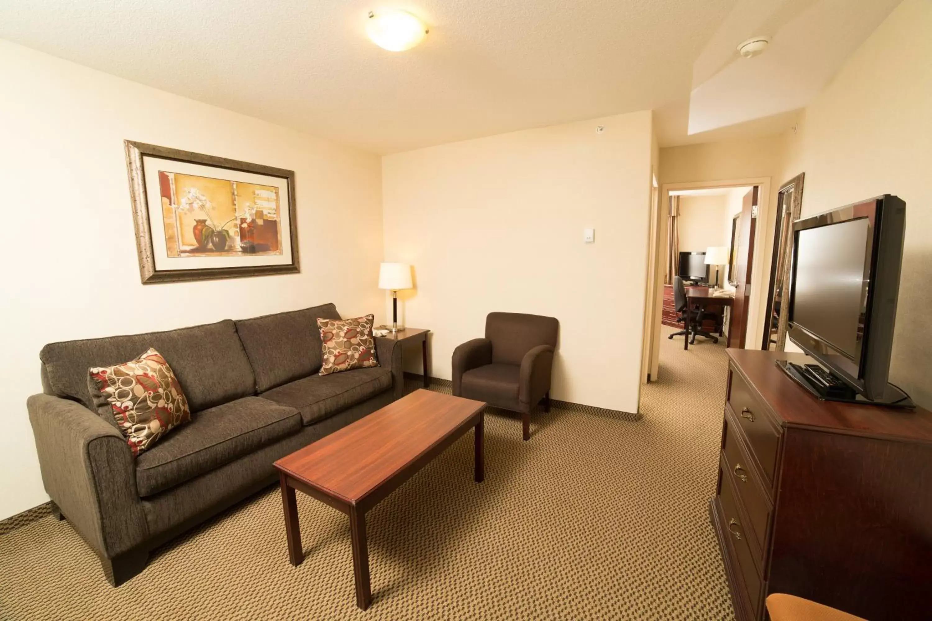 Bedroom, Seating Area in Holiday Inn & Suites Lloydminster, an IHG Hotel