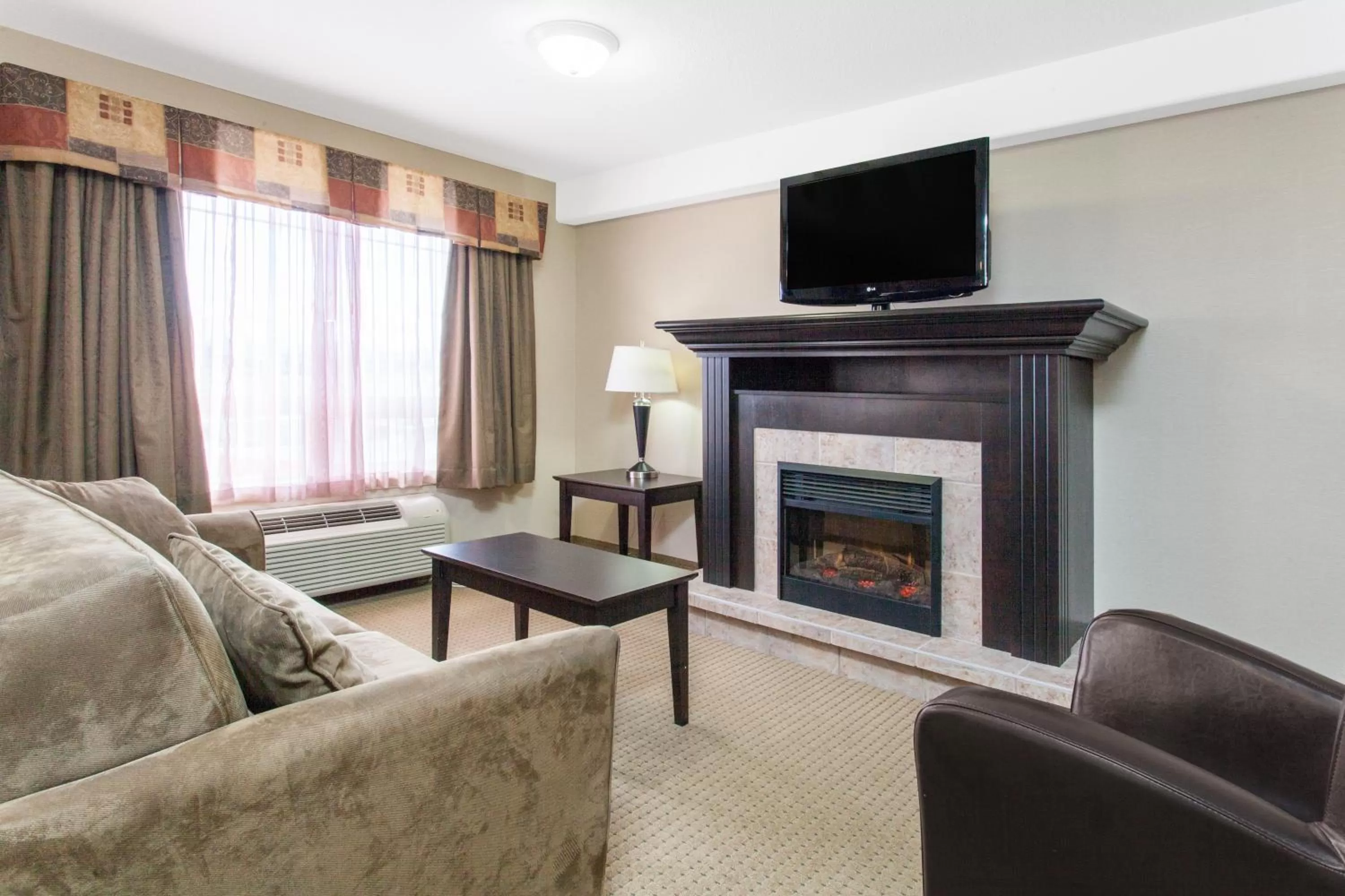Living room in Ramada by Wyndham Pincher Creek