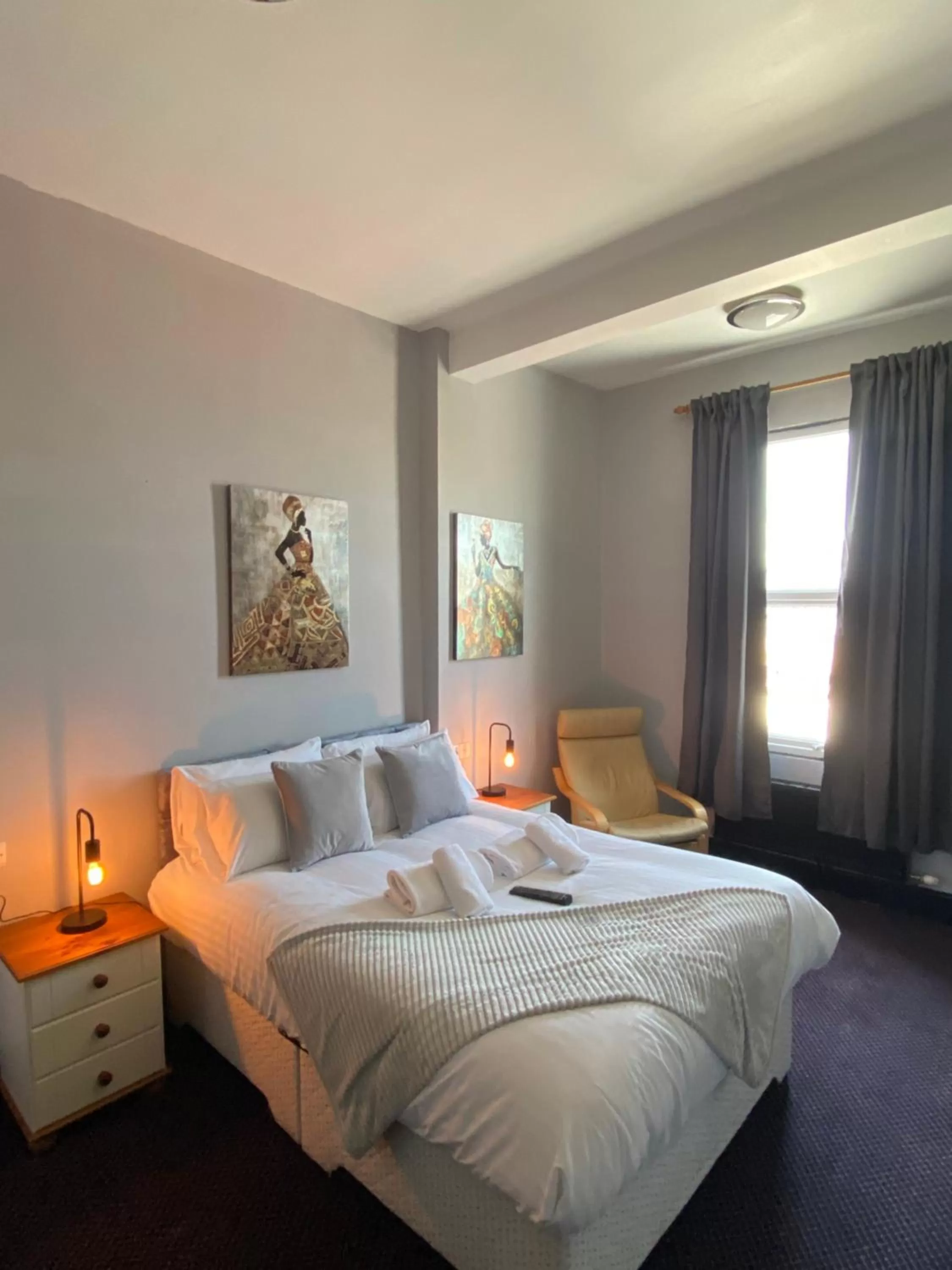 Bed in Bay view rooms at Mentone Hotel