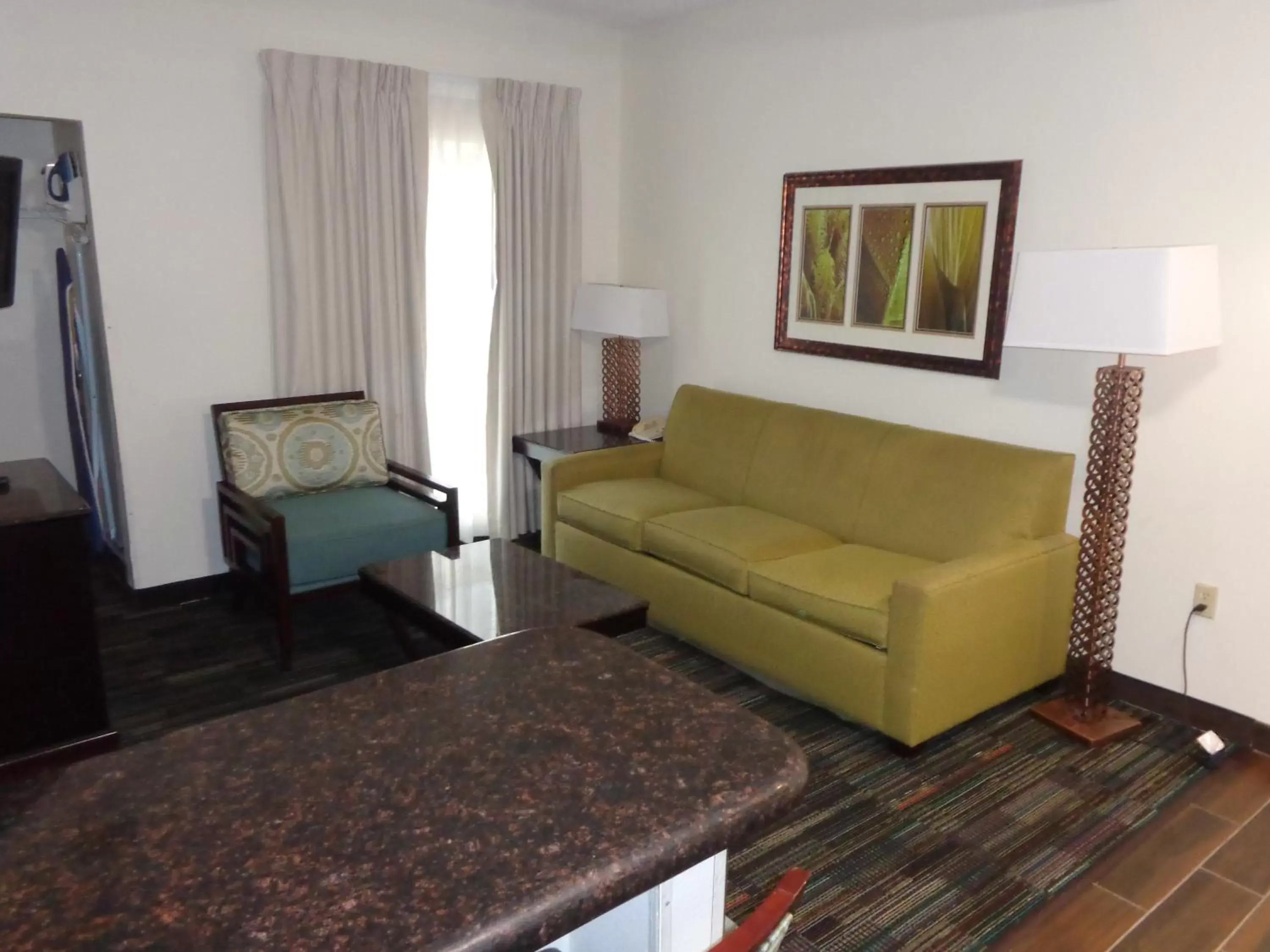 Living room, Seating Area in SureStay Plus by Best Western Orlando Lake Buena Vista