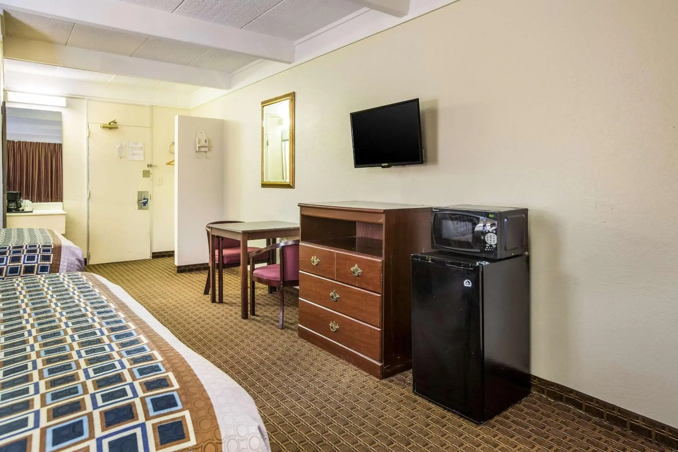 Photo of the whole room, TV/Entertainment Center in Super 8 by Wyndham Macon GA