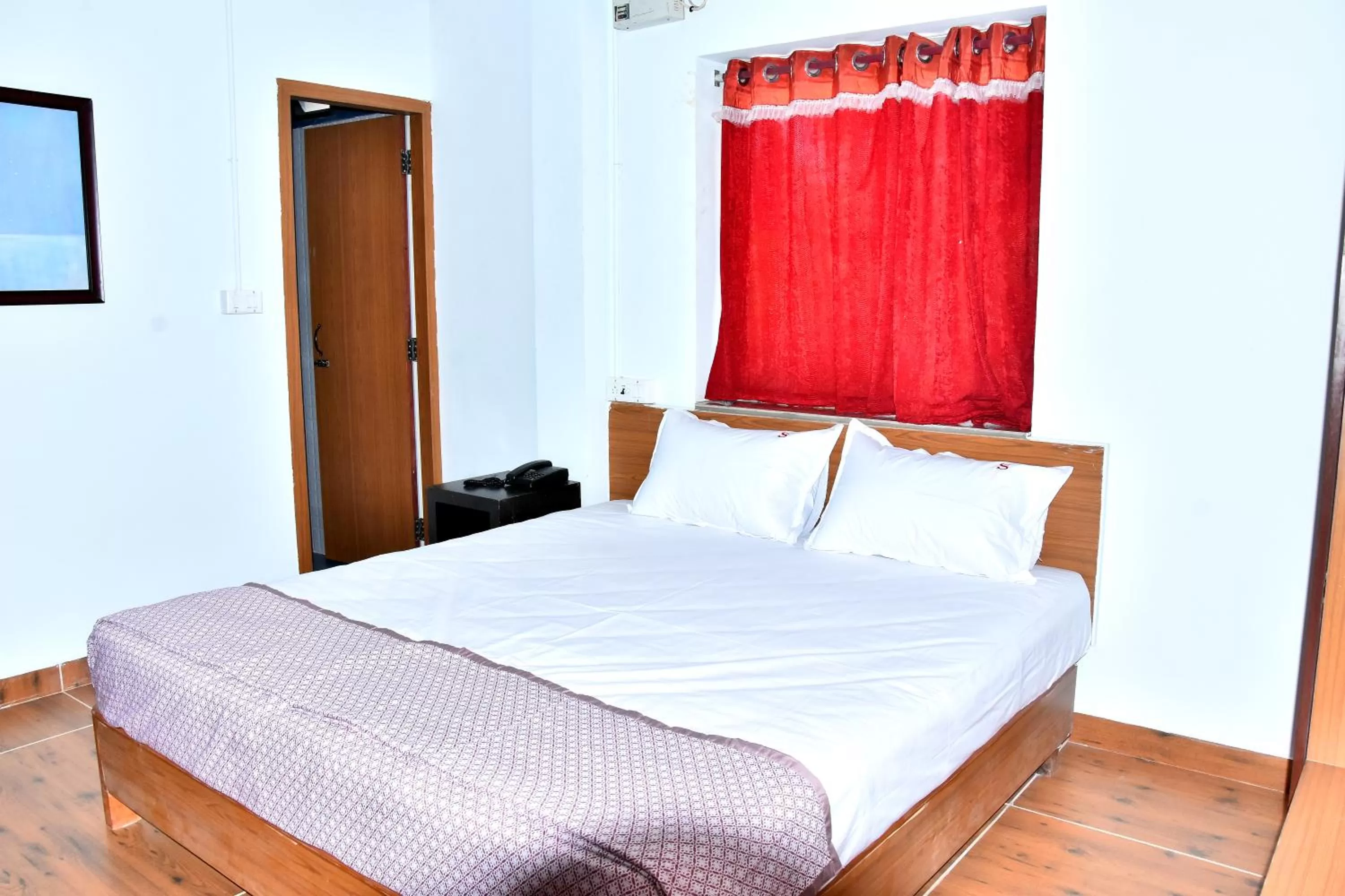 Bed in Sangam Inn & Banquets