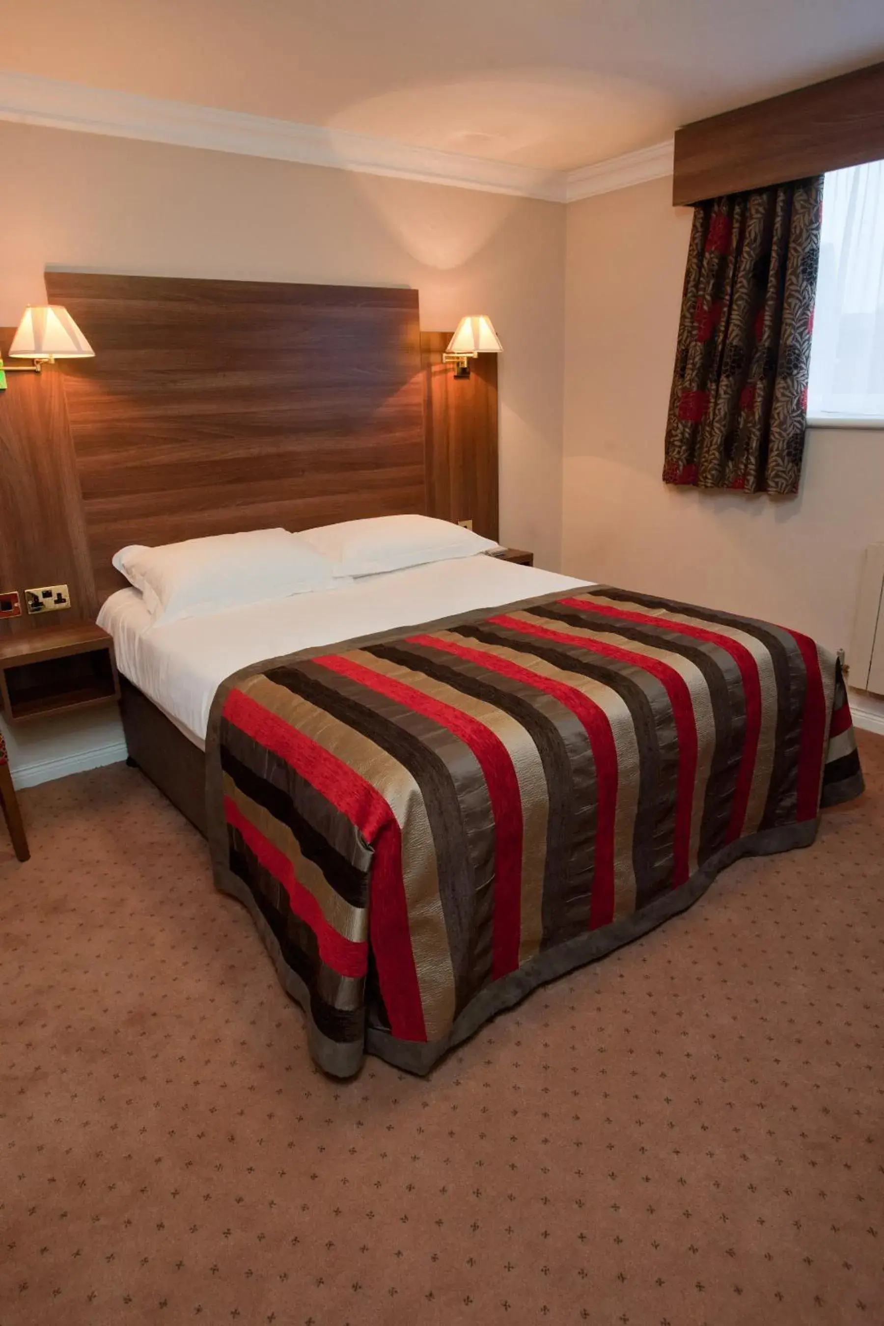 Bed in Adair Arms Hotel