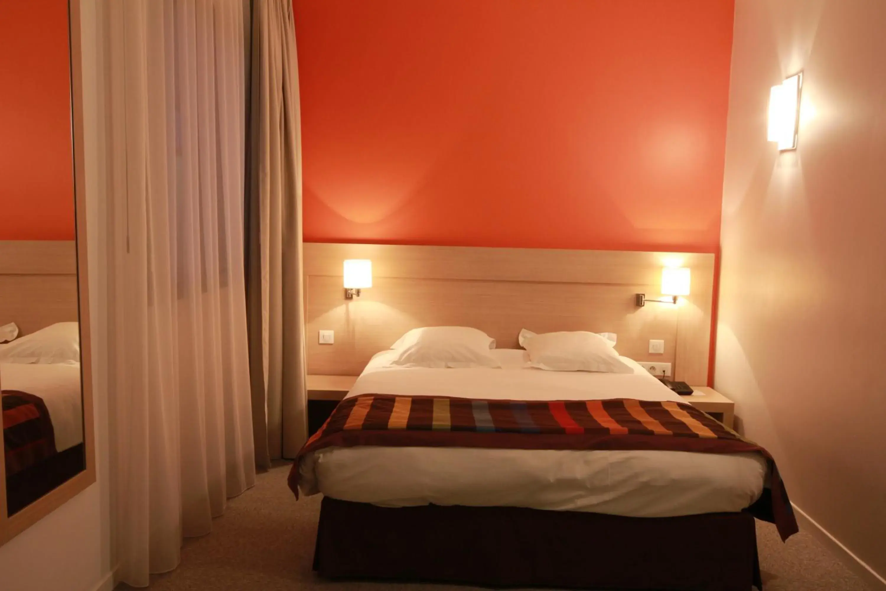 Bed in Esatitude Hotel