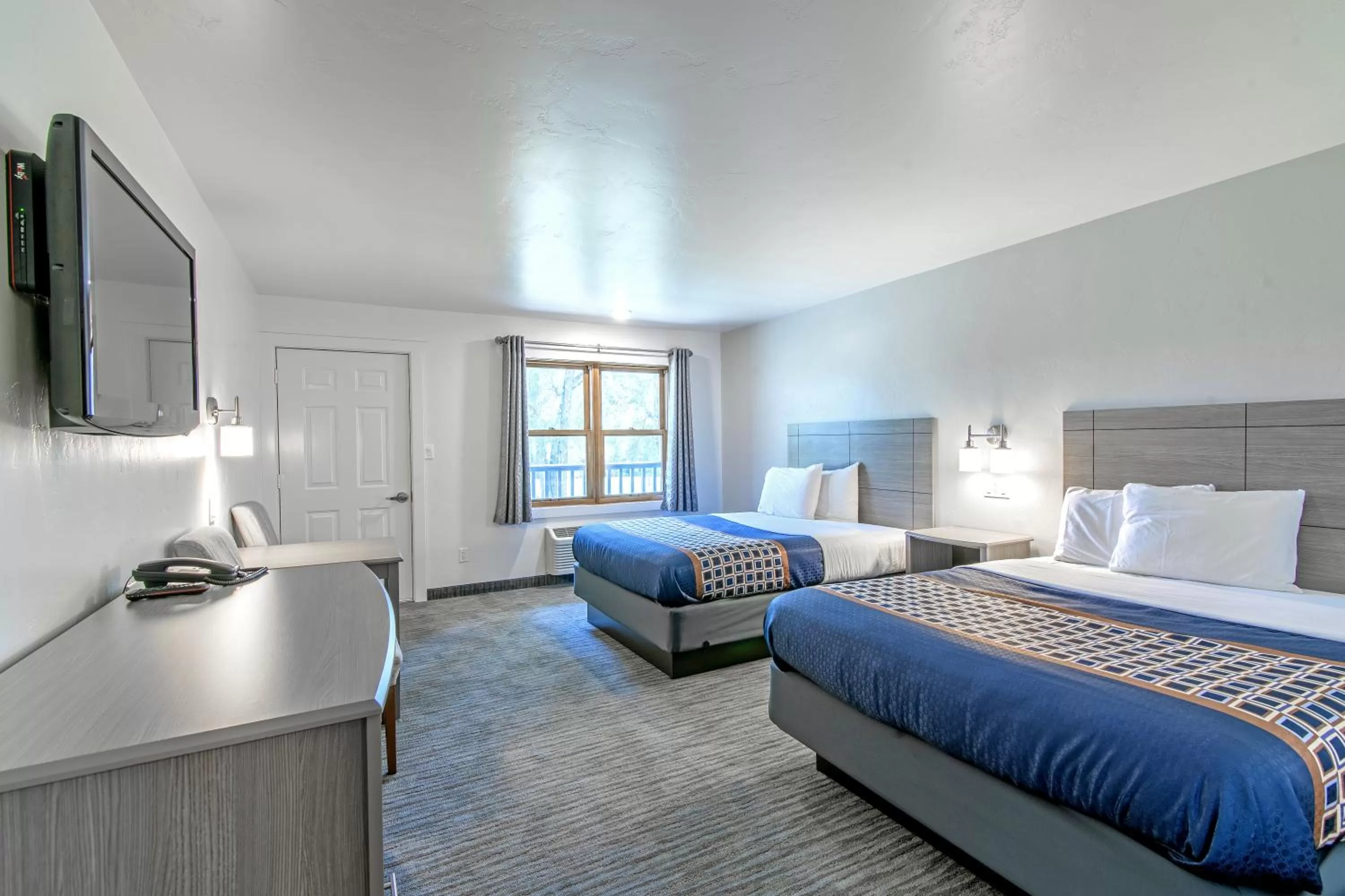 Bed in The Gunnison Inn at Dos Rios Golf Course