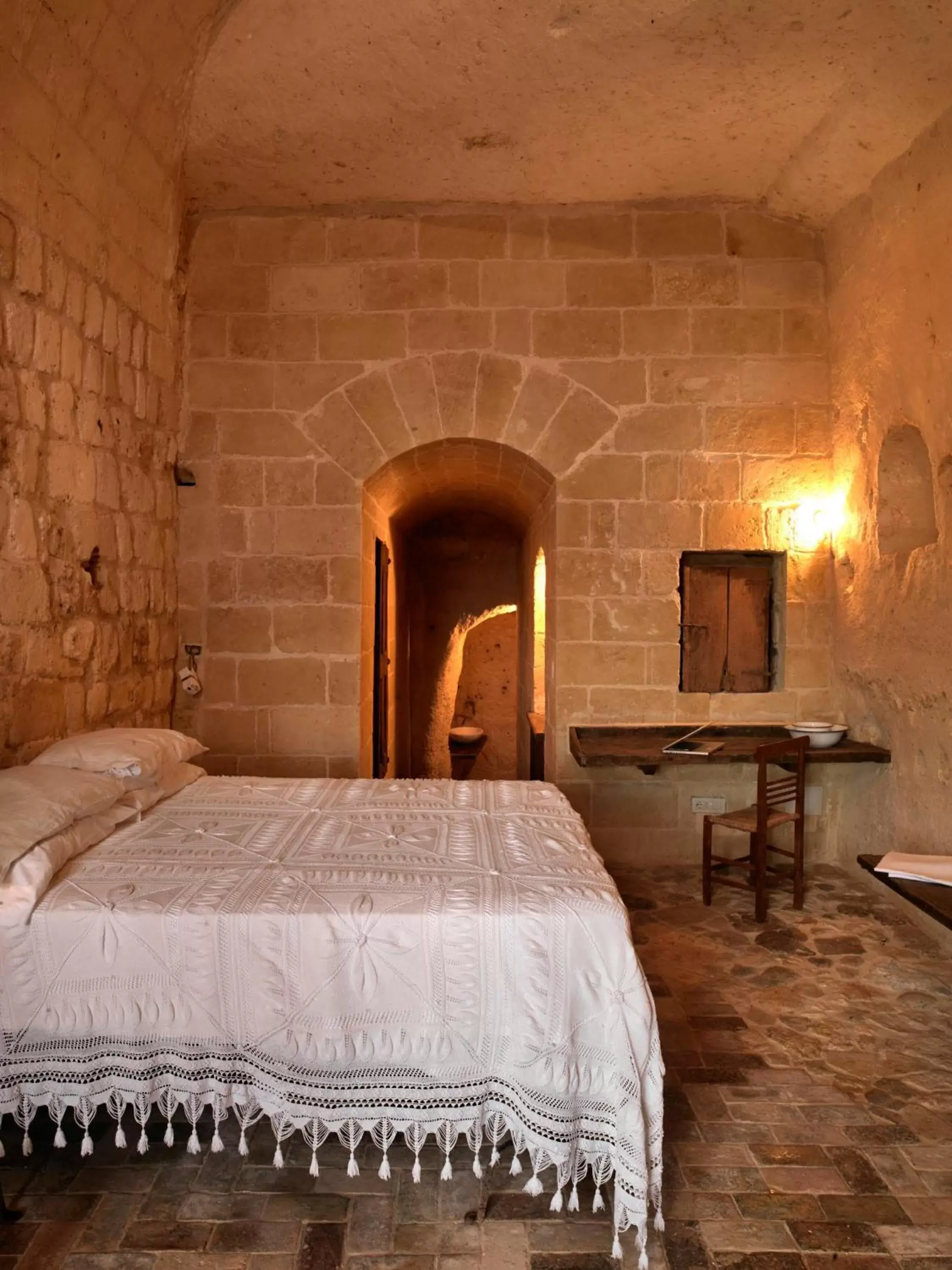 Photo of the whole room, Bed in Sextantio Le Grotte Della Civita