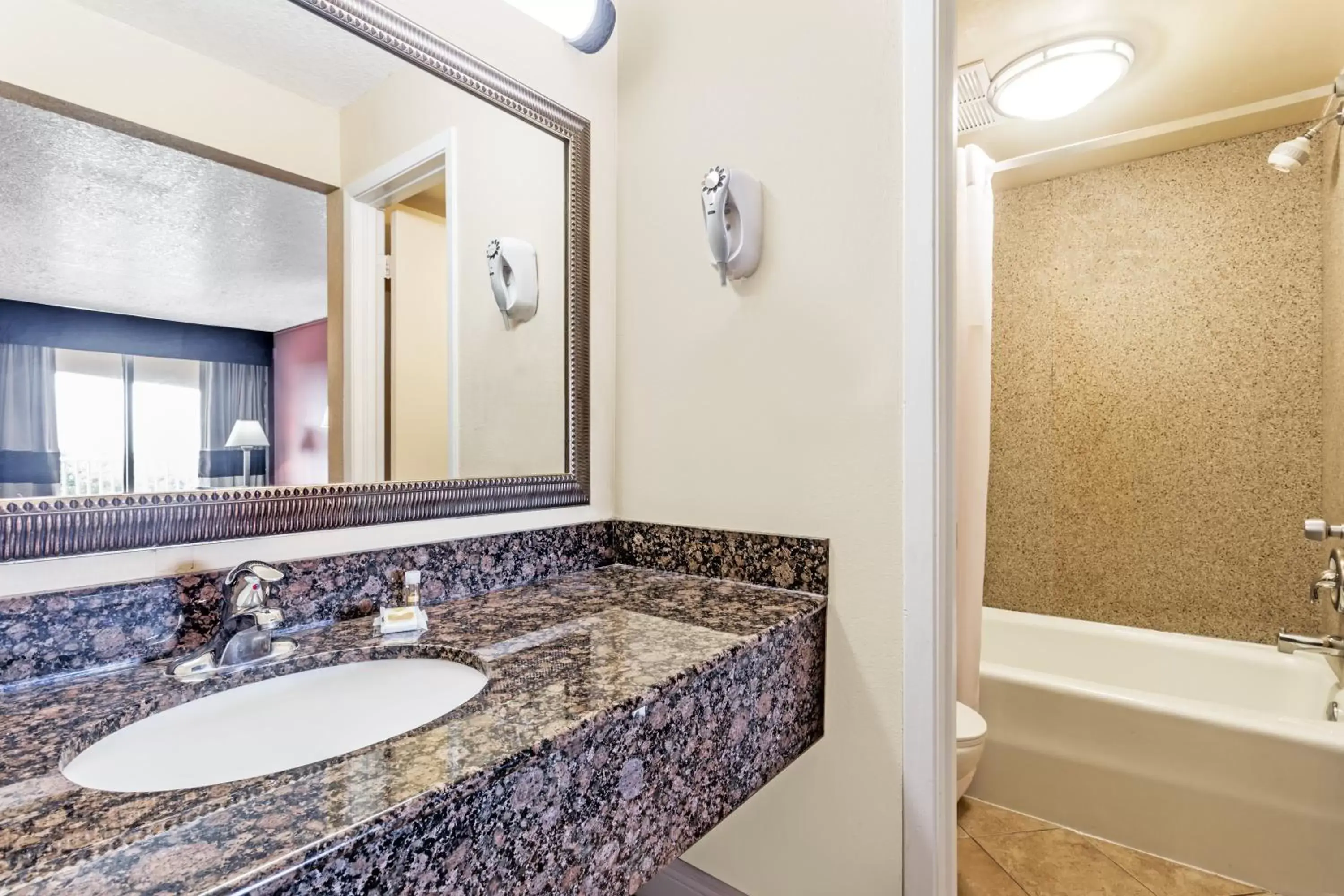 Bathroom in Days Inn by Wyndham Fort Lauderdale-Oakland Park Airport N