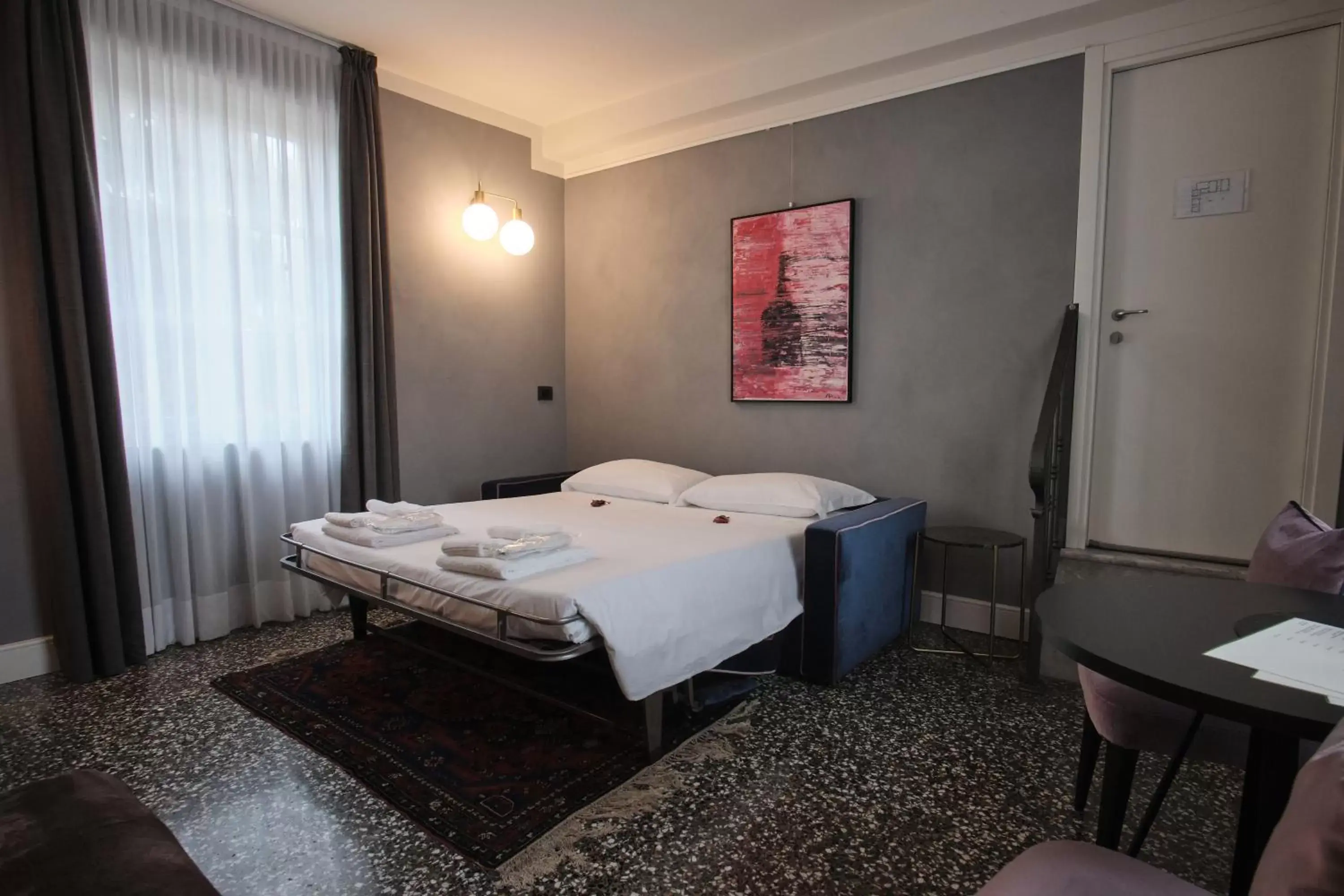 Bed in Capriccio Art Hotel