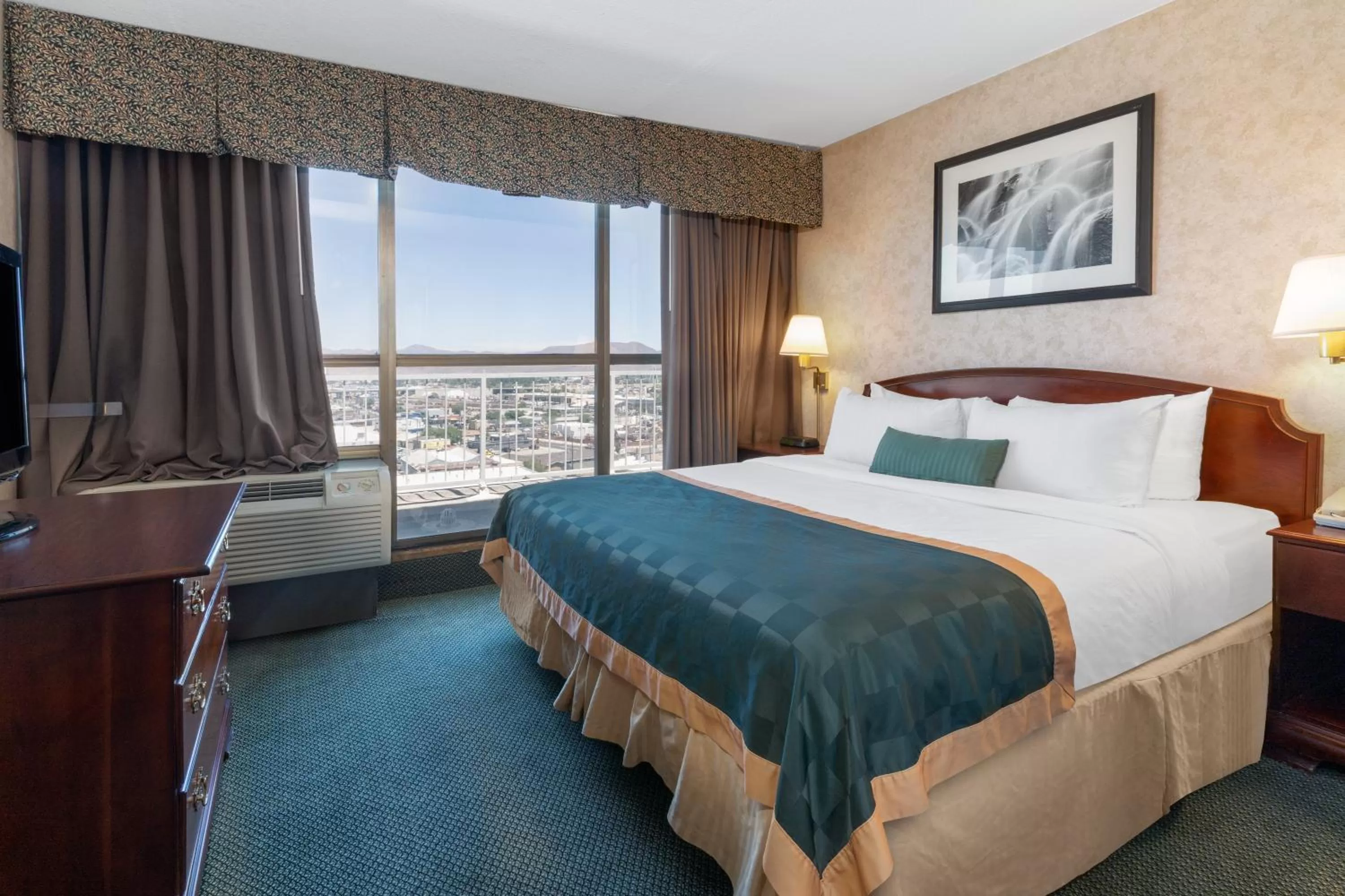 Bed in Ramada by Wyndham Reno Hotel & Casino