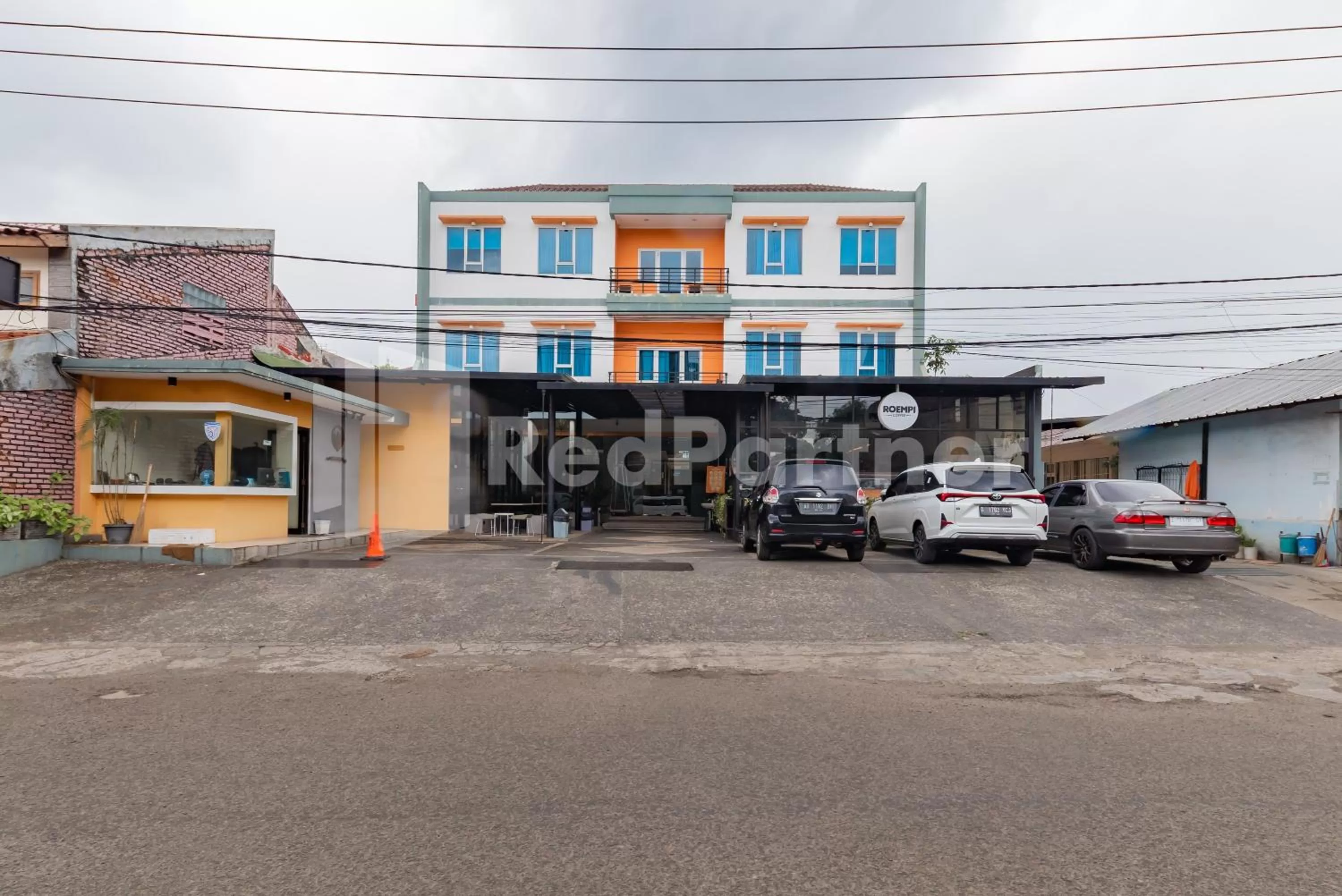 Property building in Alqueby Hotel near Kiara Artha Park & Trans Studio Mall Mitra RedDoorz