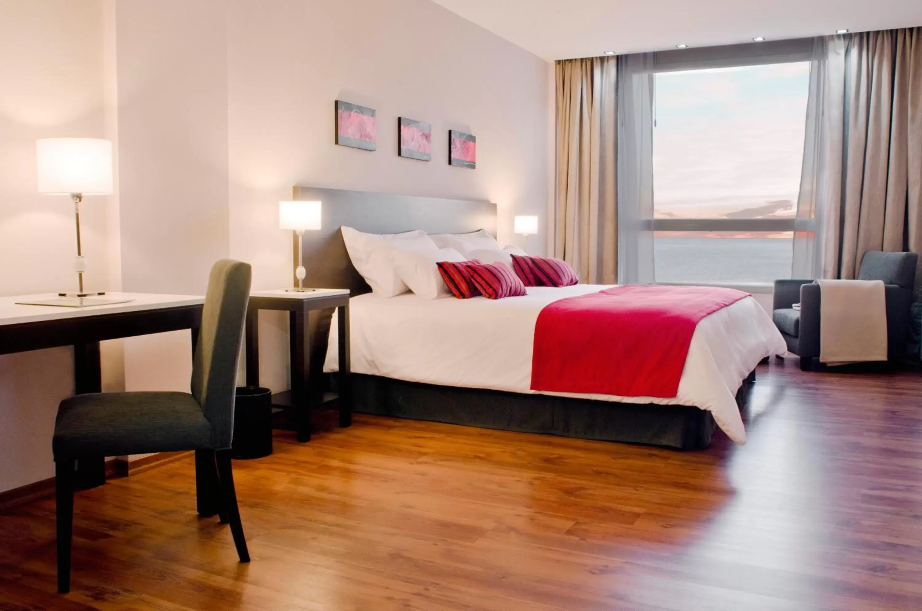 Photo of the whole room, Bed in Dazzler by Wyndham Puerto Madryn