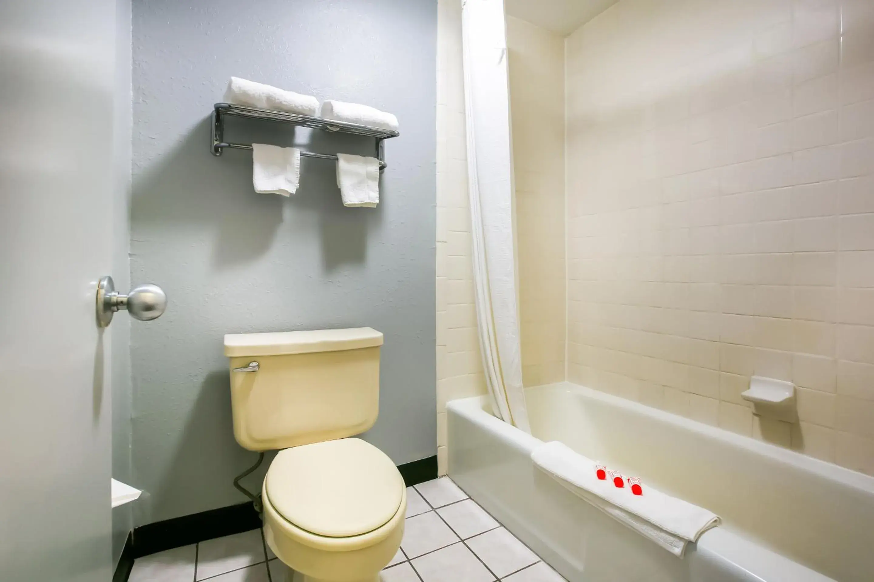 Toilet, Bathroom in OYO Hotel Texarkana North Heights AR Hwy I-30