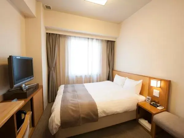 Bed in Dormy Inn Tsu