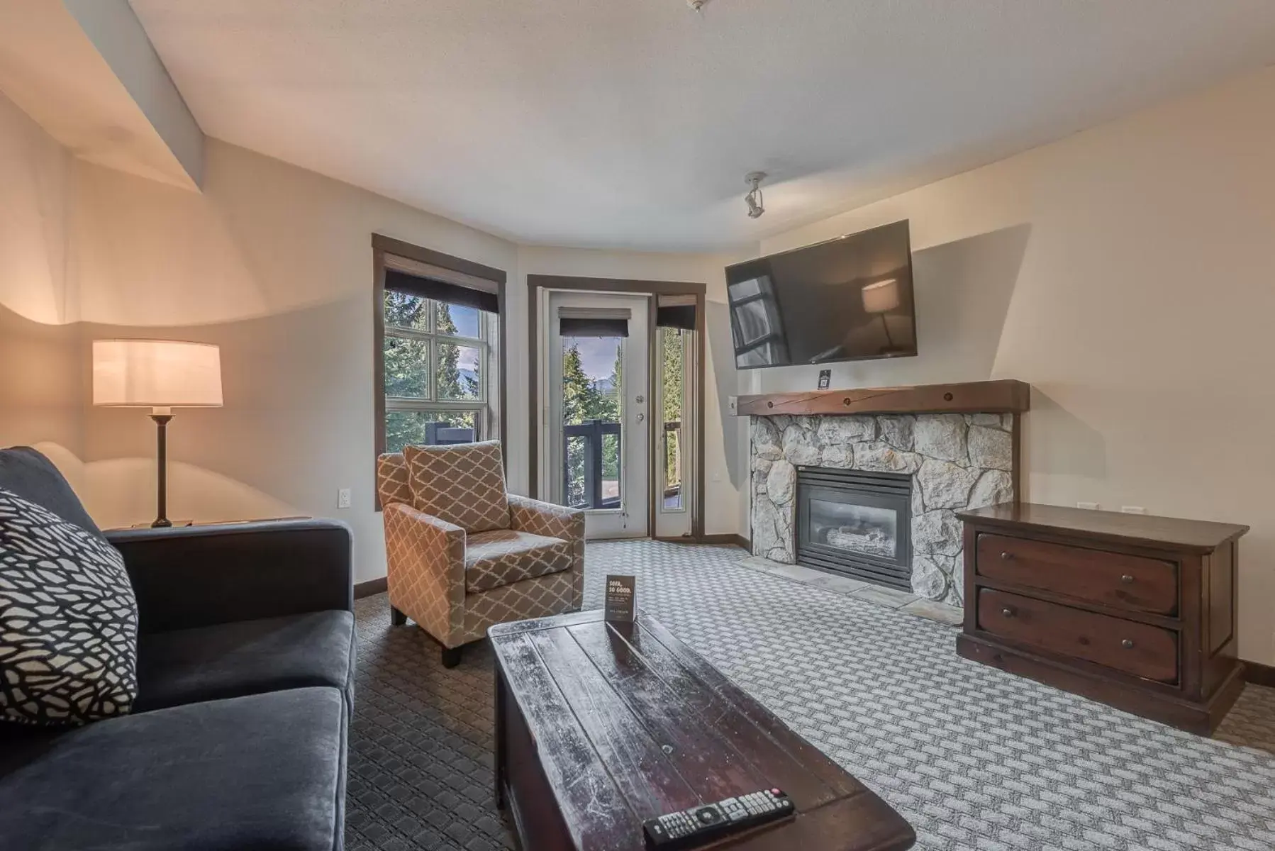 TV and multimedia, Seating Area in Blackcomb Springs Suites by CLIQUE