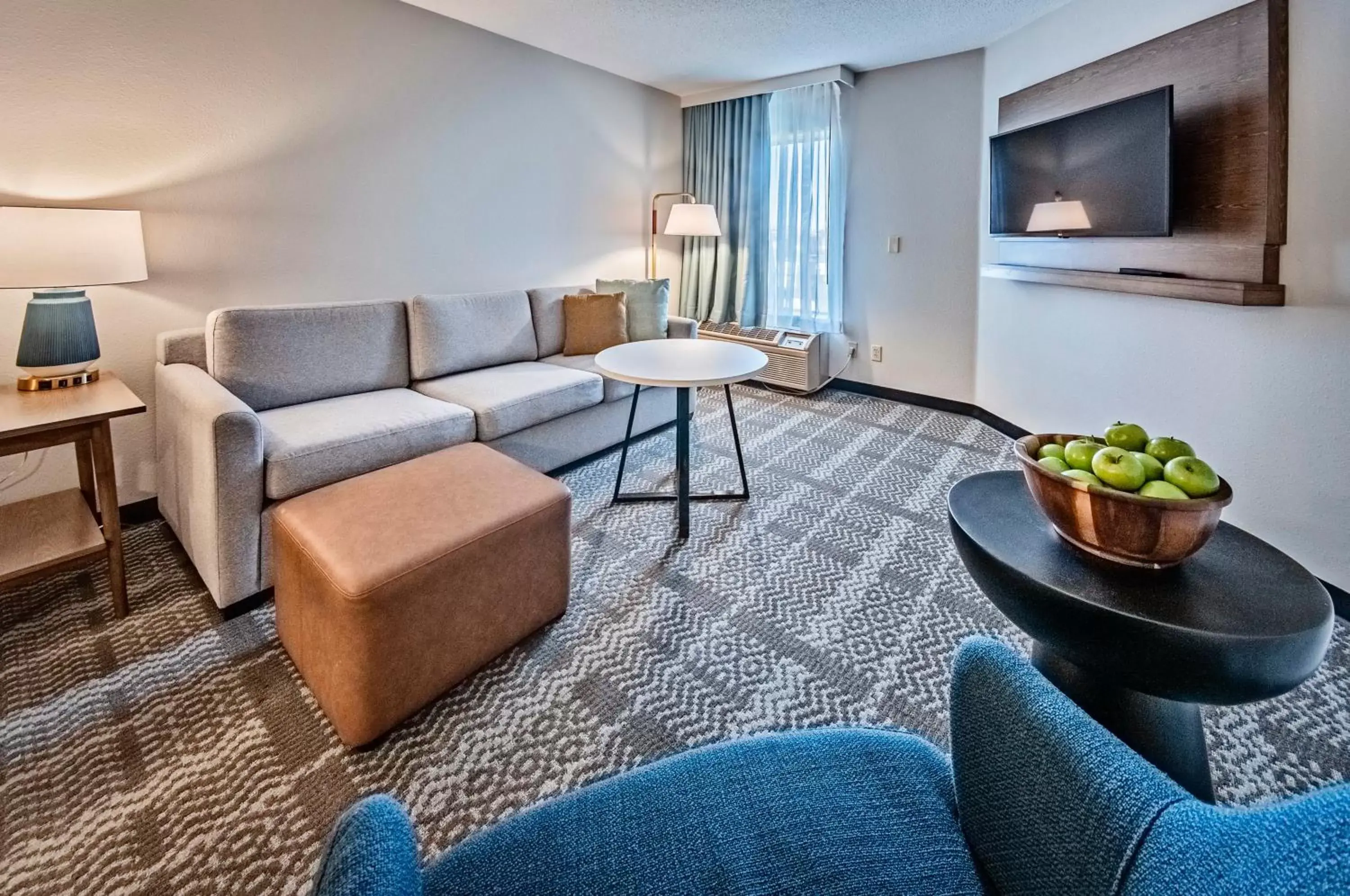 Bedroom, Seating Area in Staybridge Suites - Cedar Rapids North, an IHG Hotel