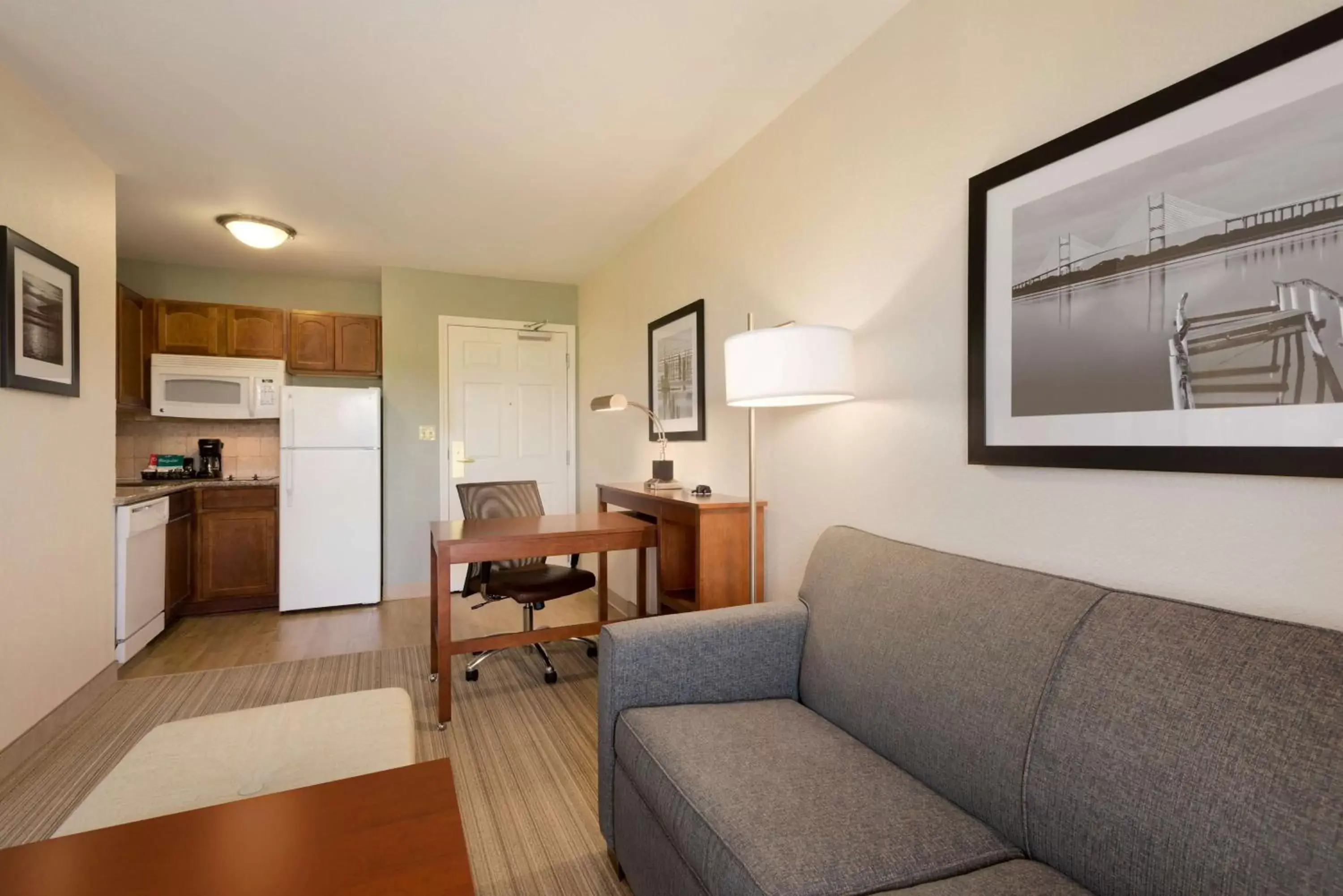 Bed, Seating Area in Homewood Suites Jacksonville Deerwood Park