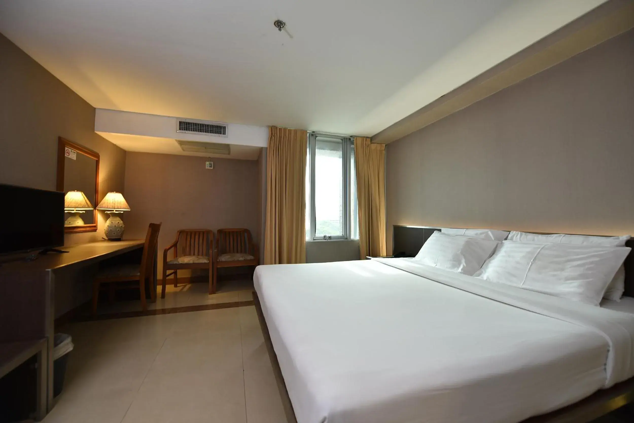 Bed in Bangkok City Suite
