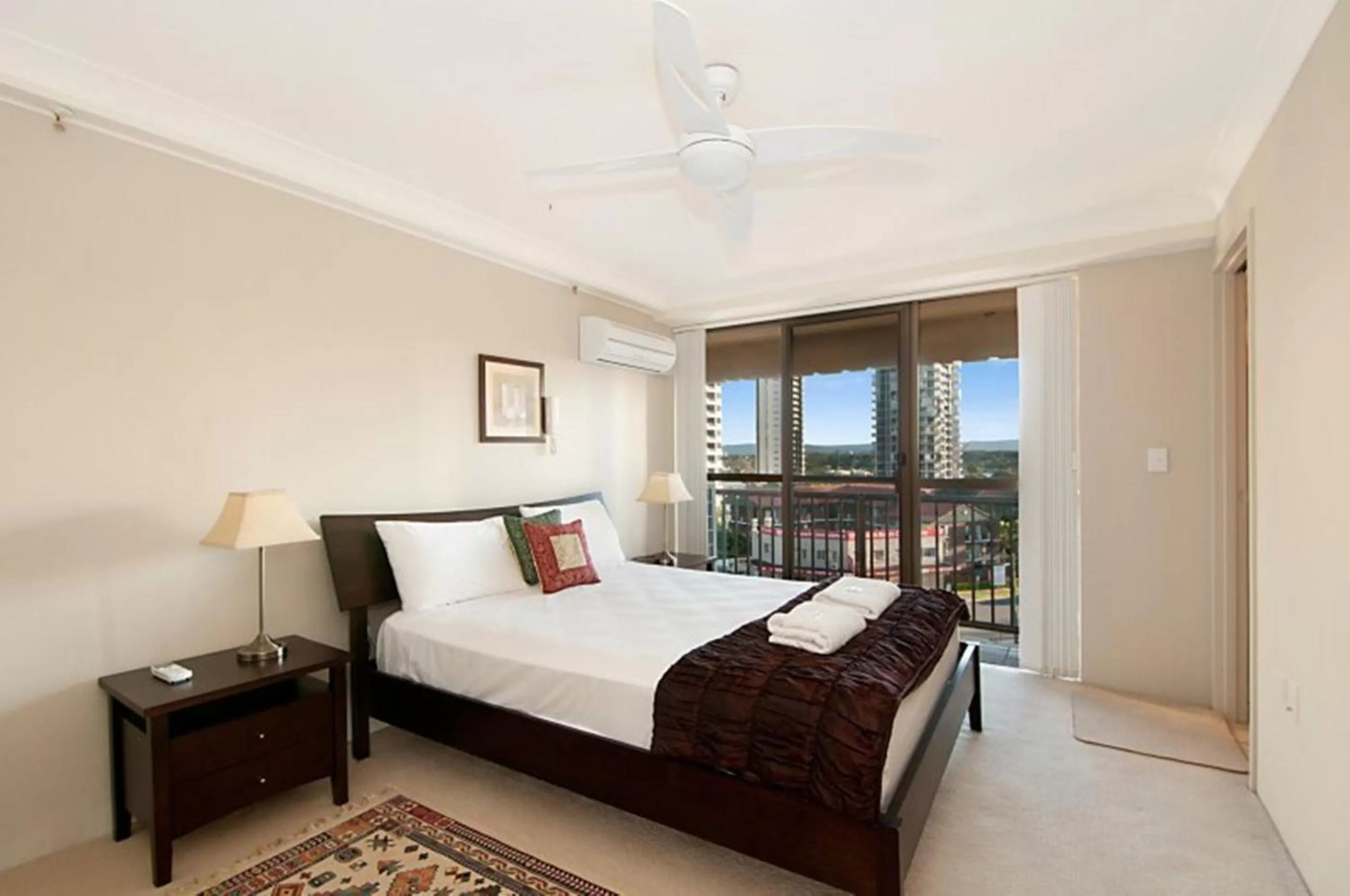 Bed in De Ville Apartments