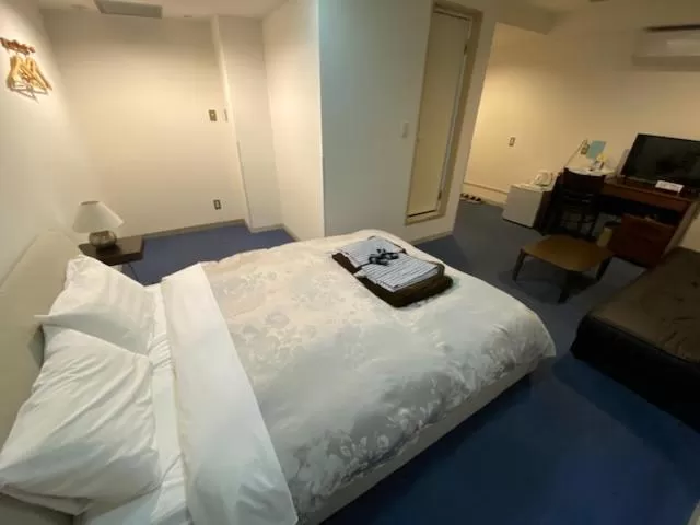 Bed in Hotel New Yutaka