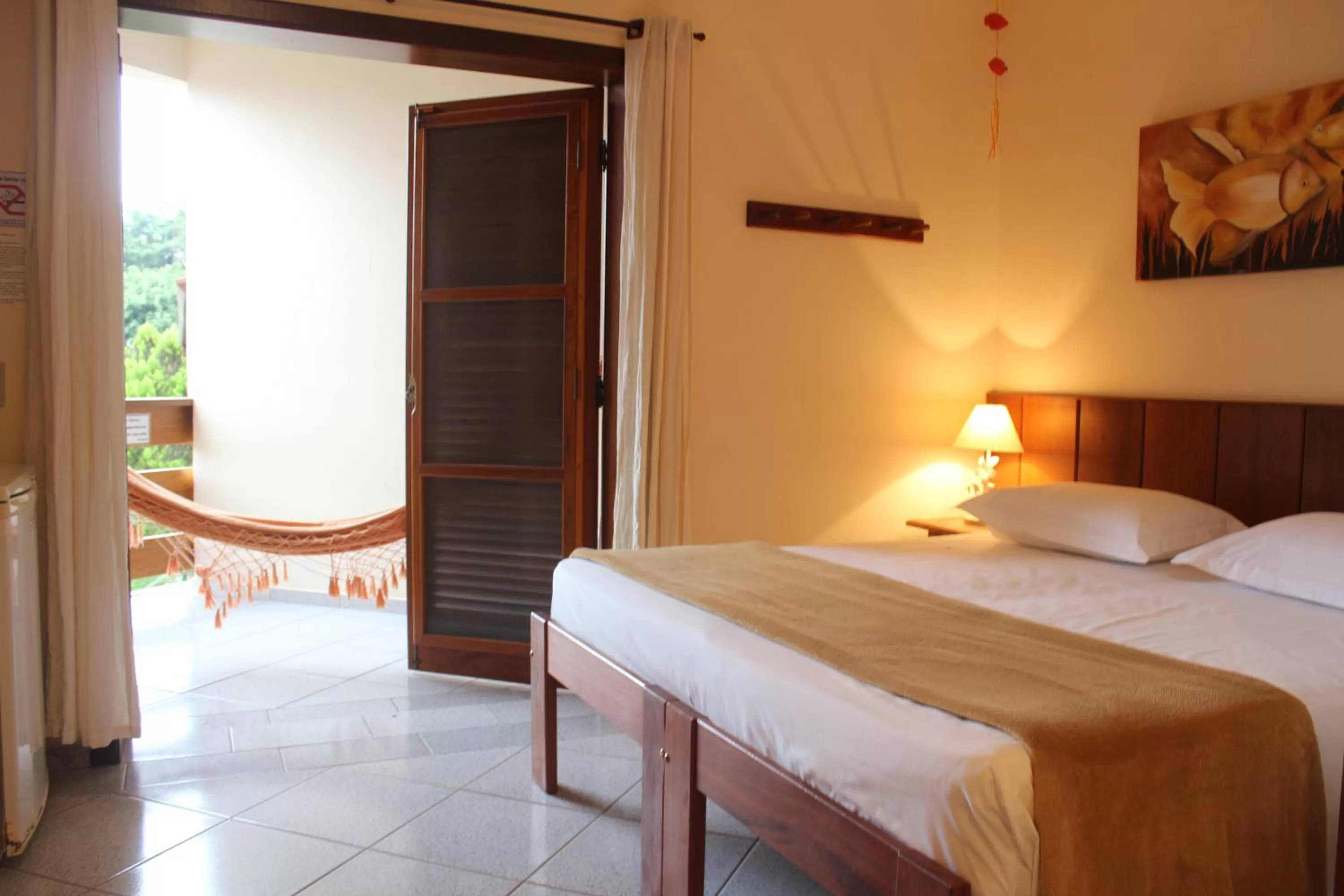 Bed in Pousada Vivamar